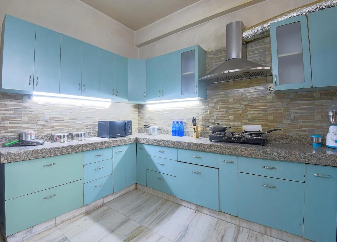 Kitchen or kitchenette in BedChambers Serviced Apartments - Artemis Hospital