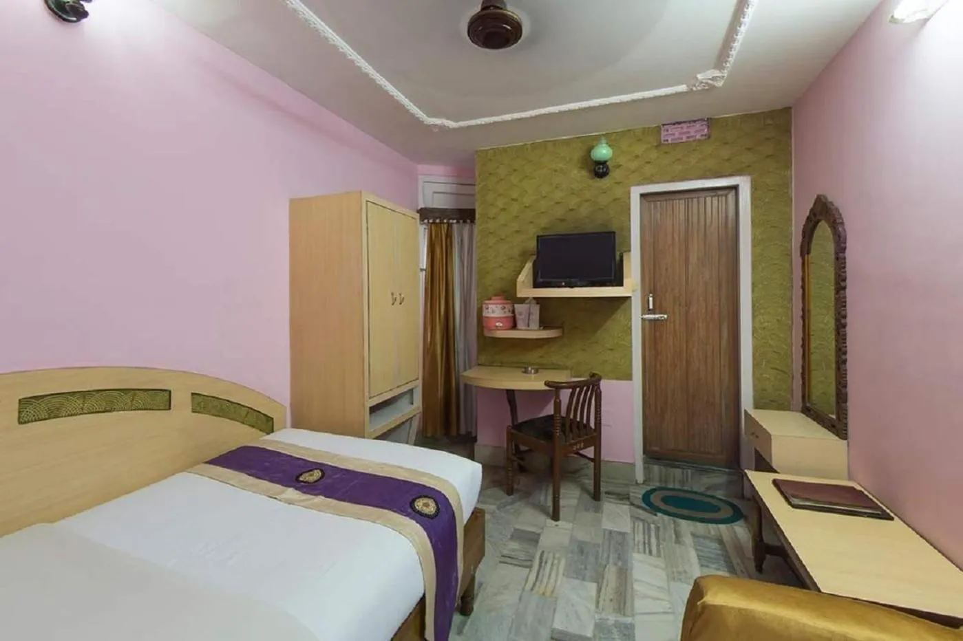 Bedroom in Hotel Mahalaxmi Indo Myanmar