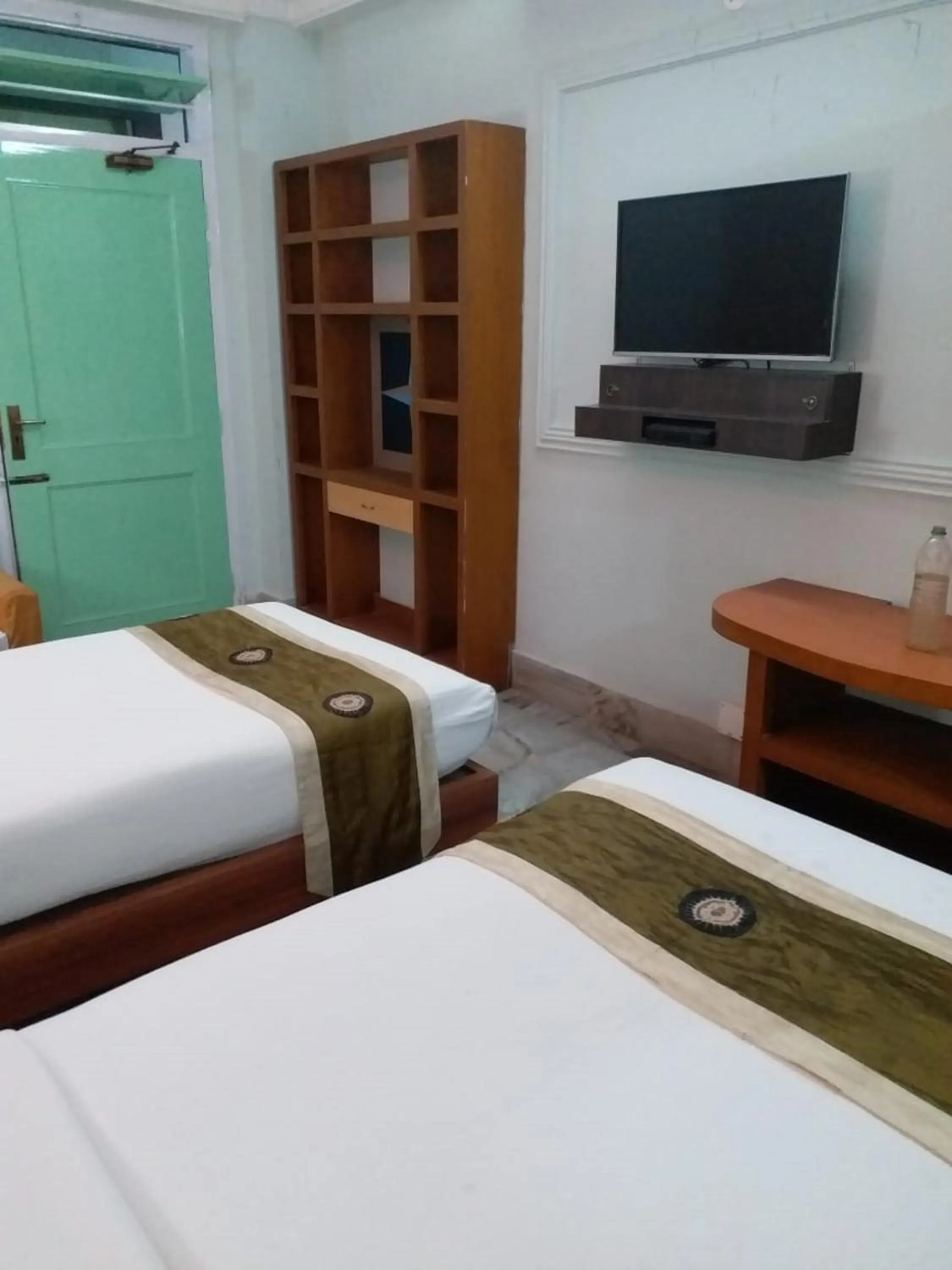 Bedroom in Hotel Mahalaxmi Indo Myanmar