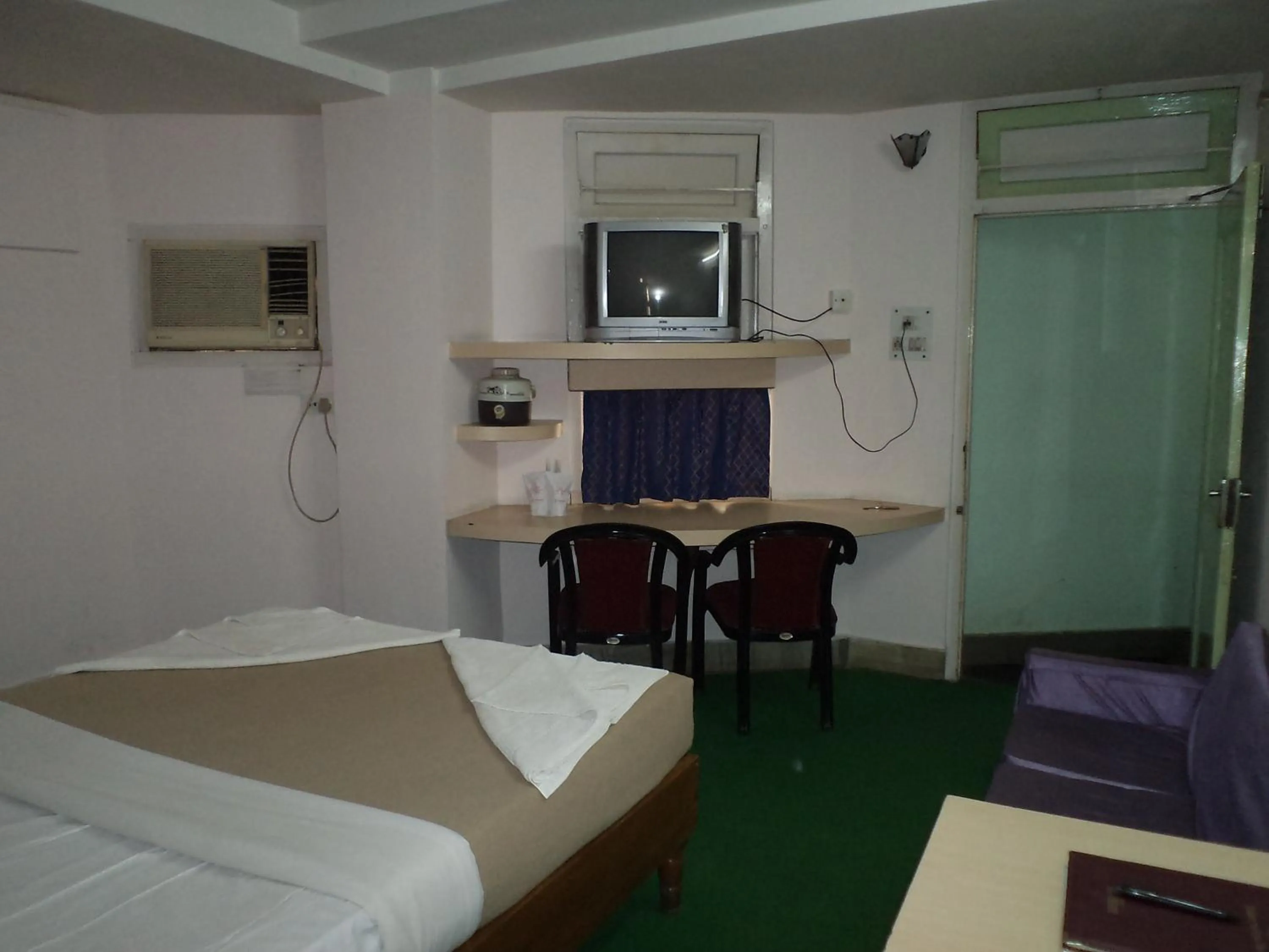 Photo of the whole room in Hotel Mahalaxmi Indo Myanmar