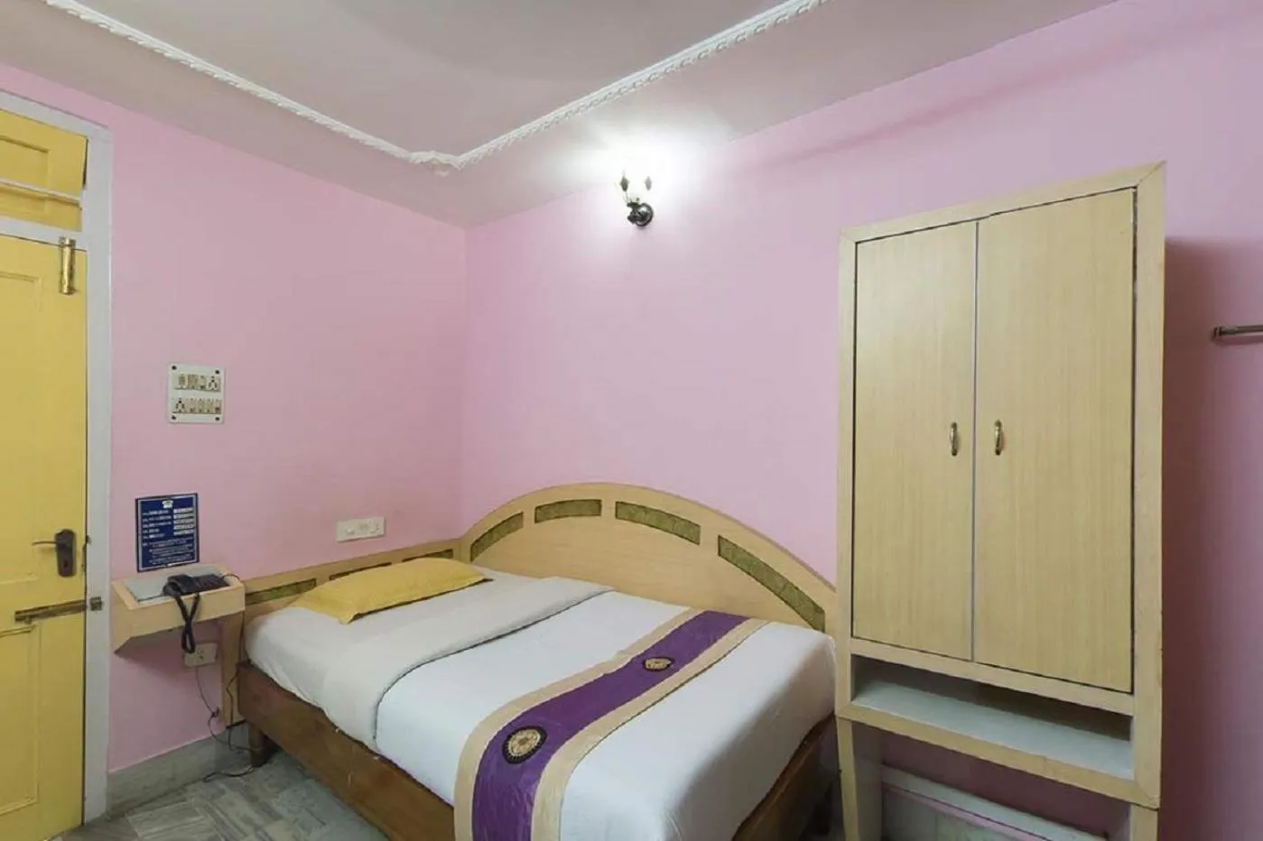 Bedroom in Hotel Mahalaxmi Indo Myanmar