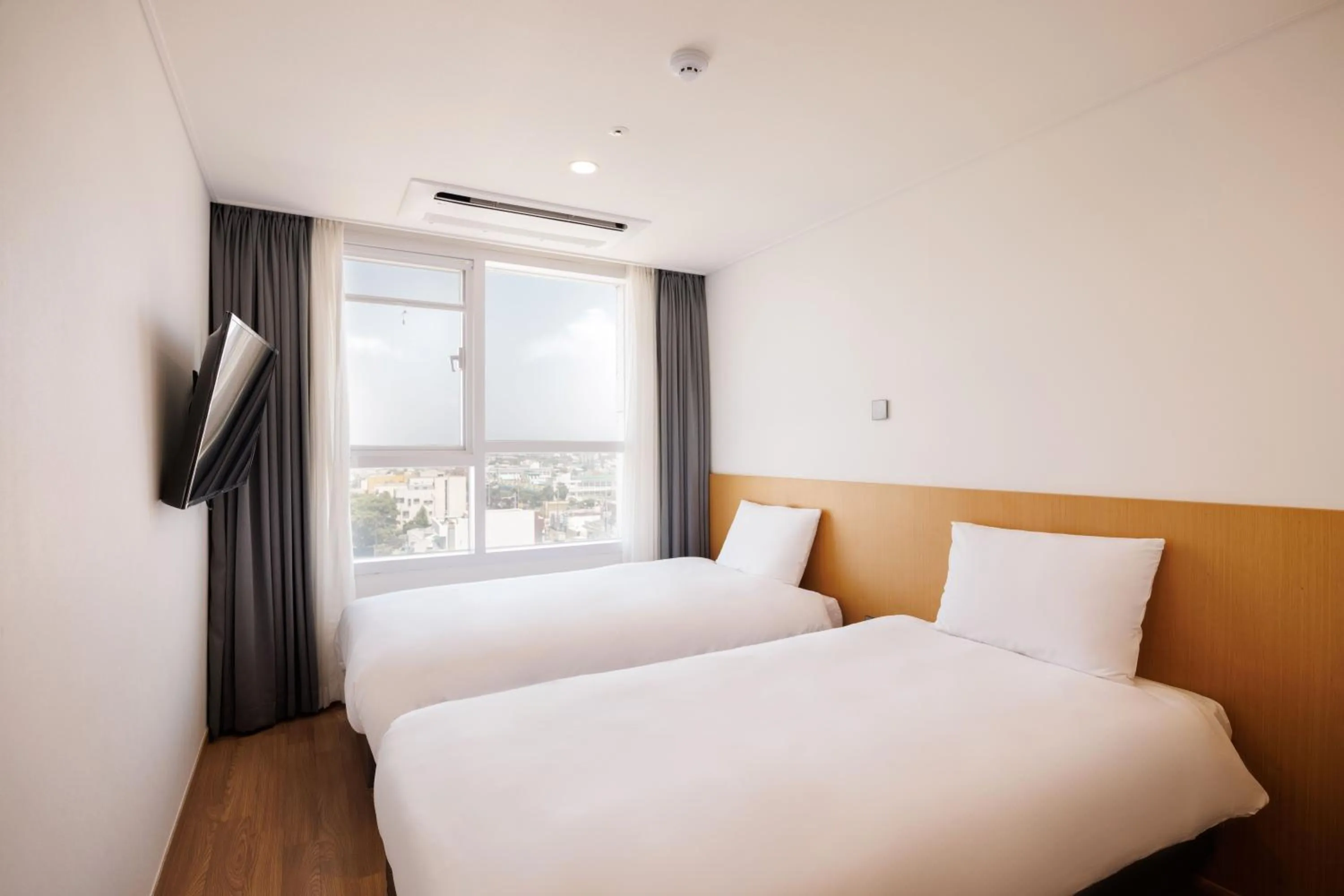 Bed in Kenny Stay Jeju Mosulpo