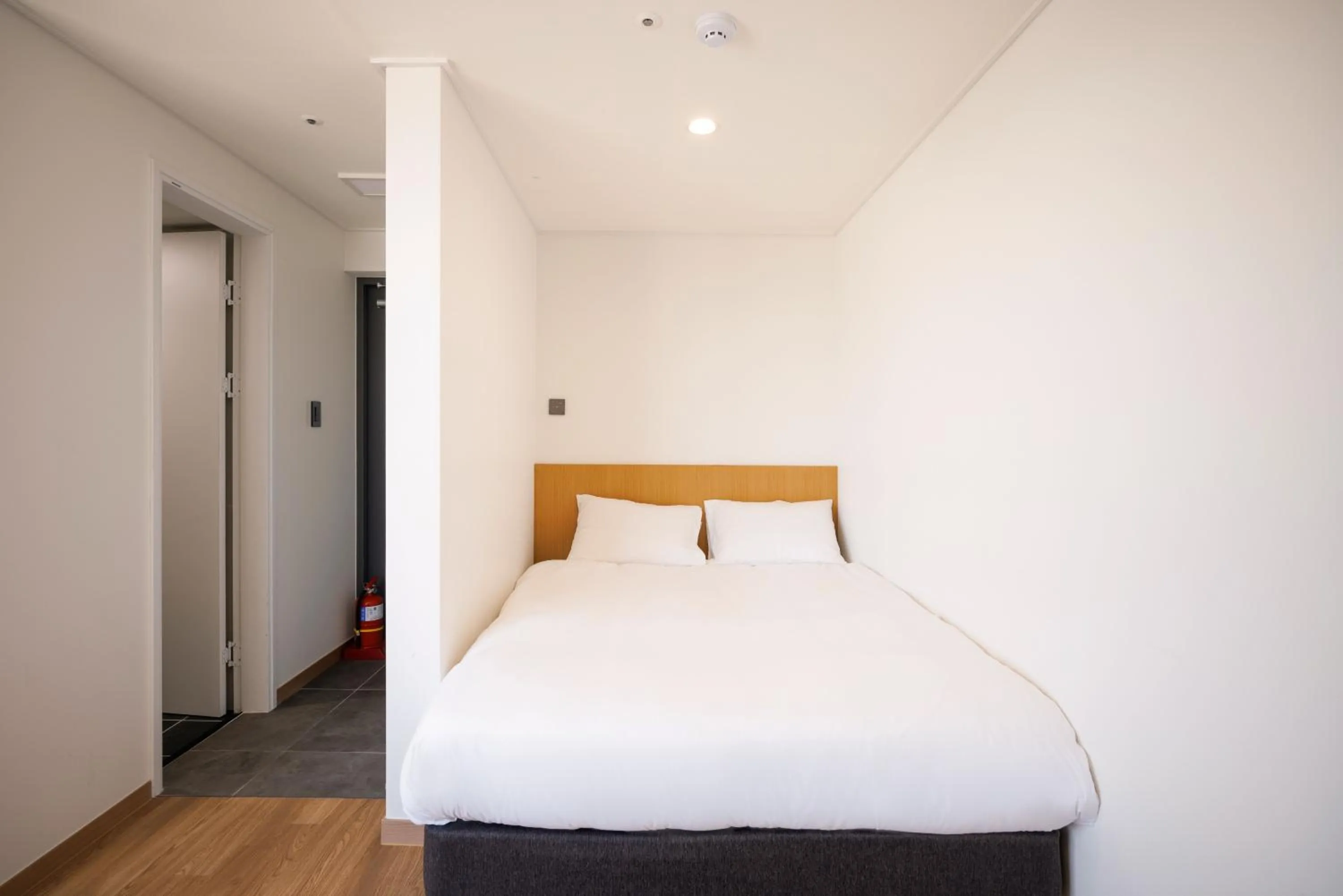 Bed in Kenny Stay Jeju Mosulpo