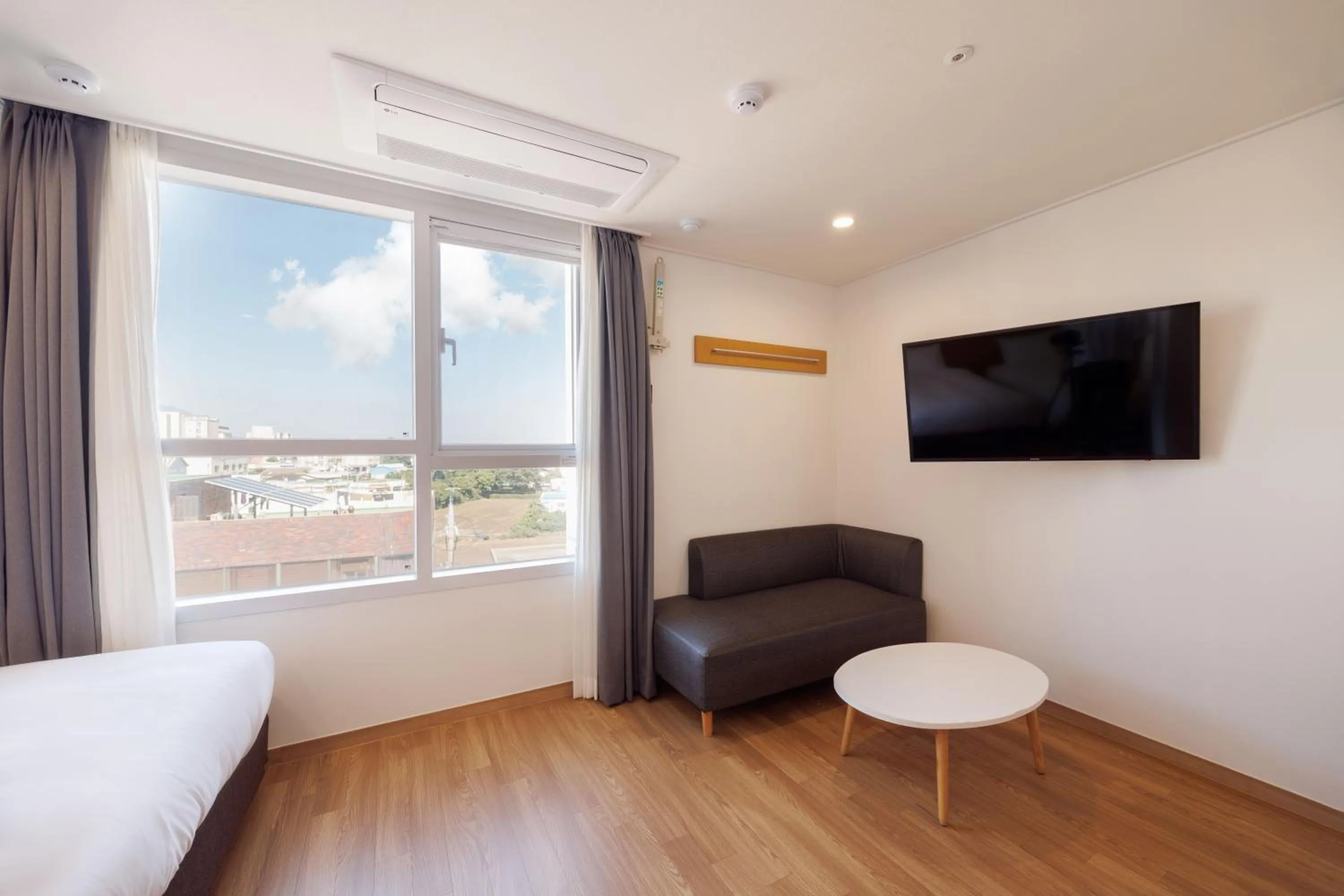 Bed in Kenny Stay Jeju Mosulpo