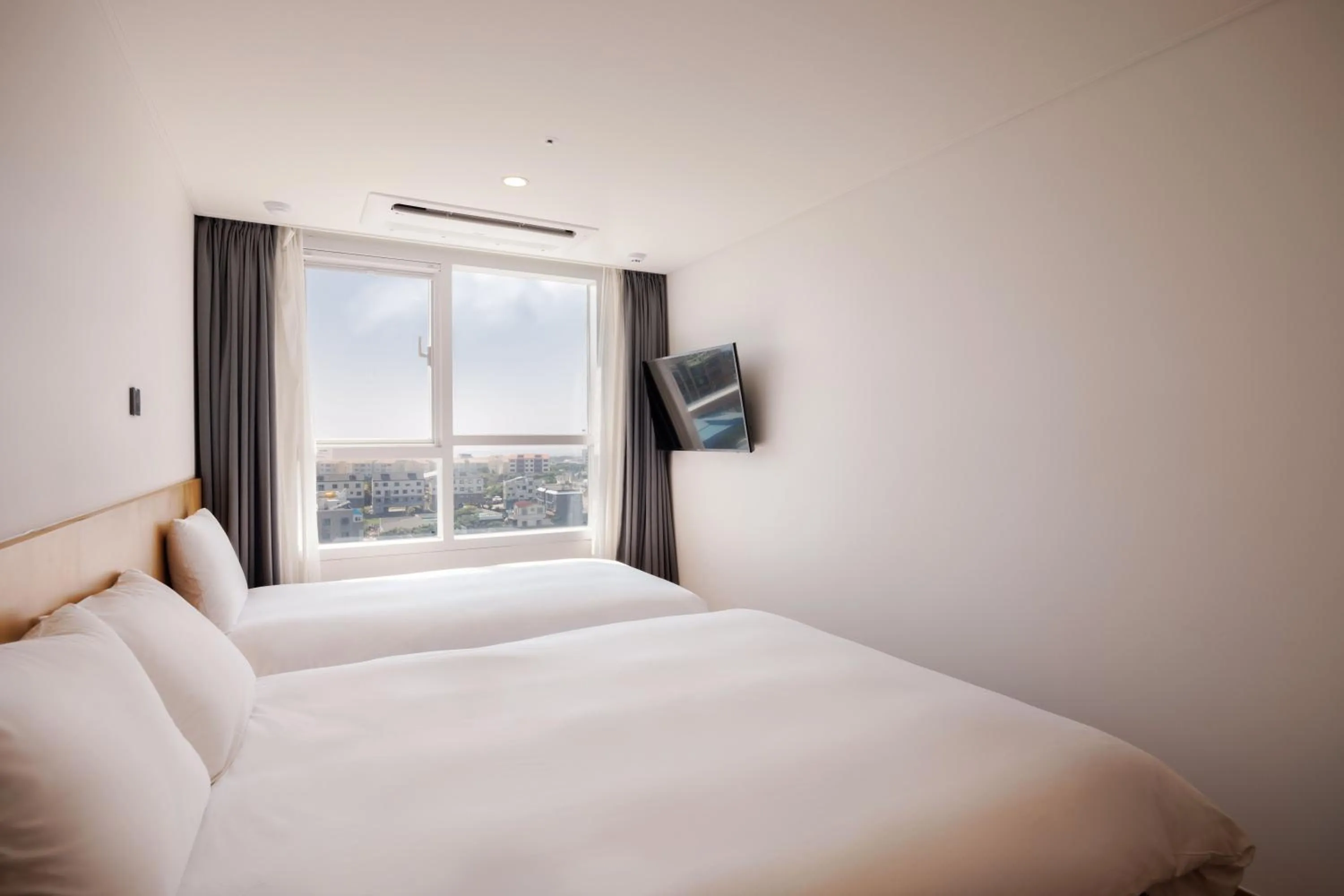 Bed in Kenny Stay Jeju Mosulpo