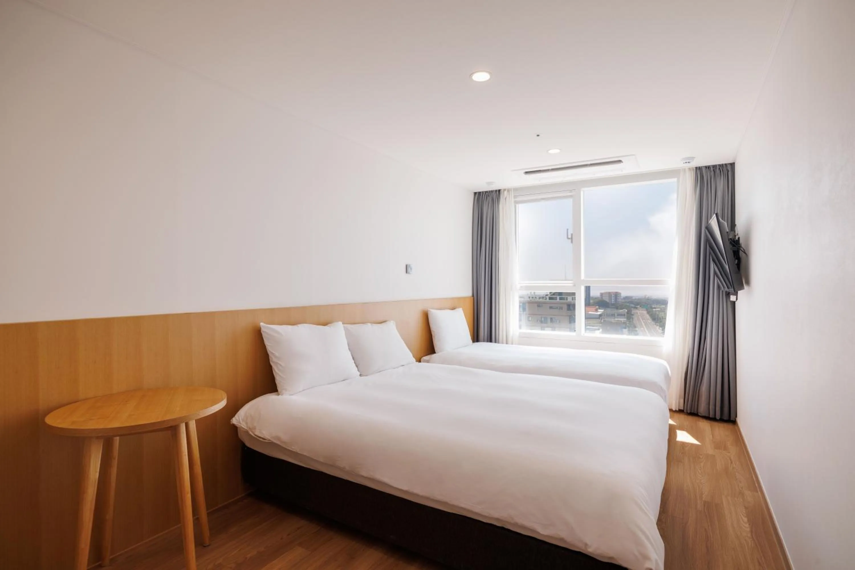 Bed in Kenny Stay Jeju Mosulpo