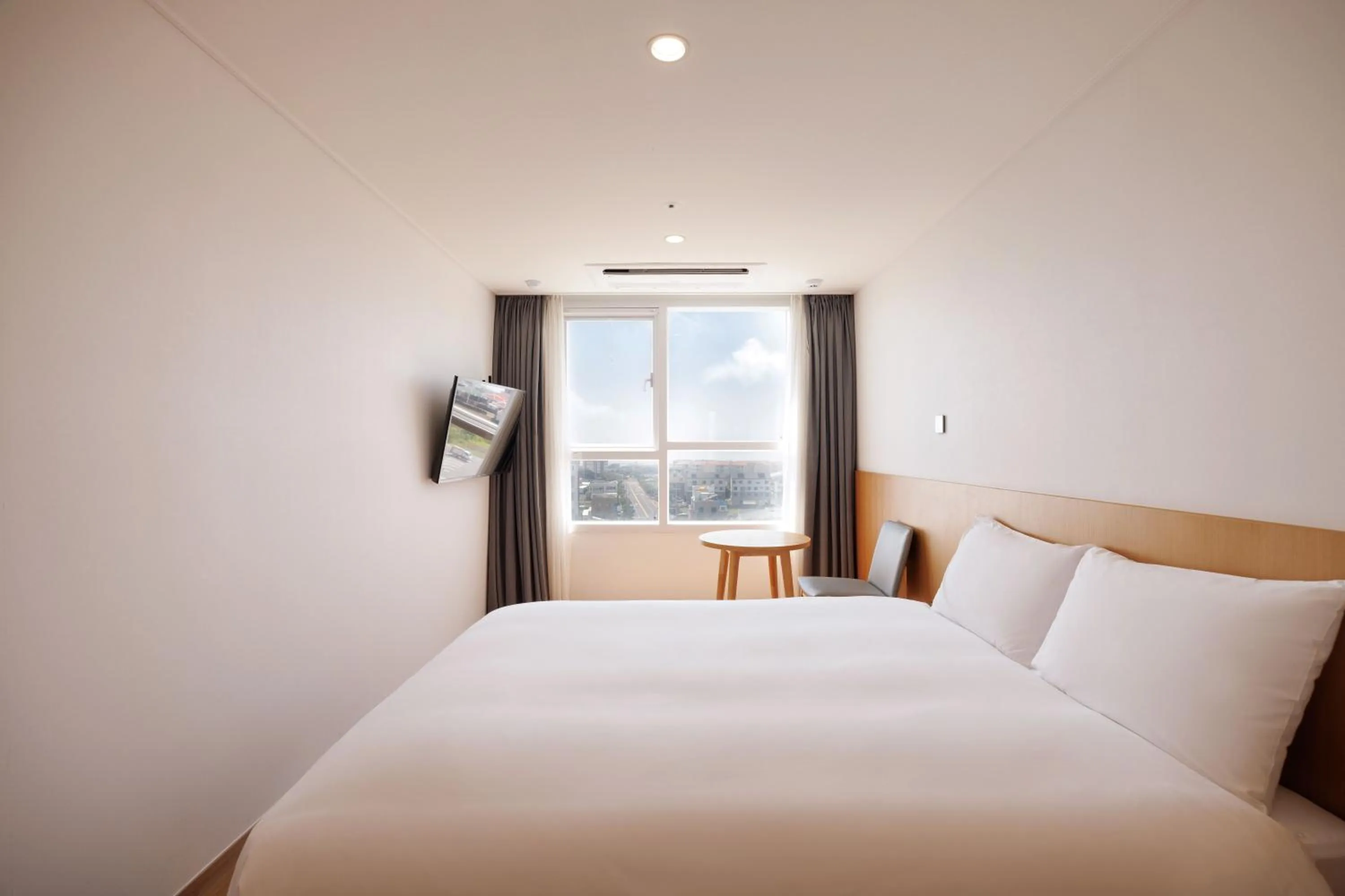Bed in Kenny Stay Jeju Mosulpo