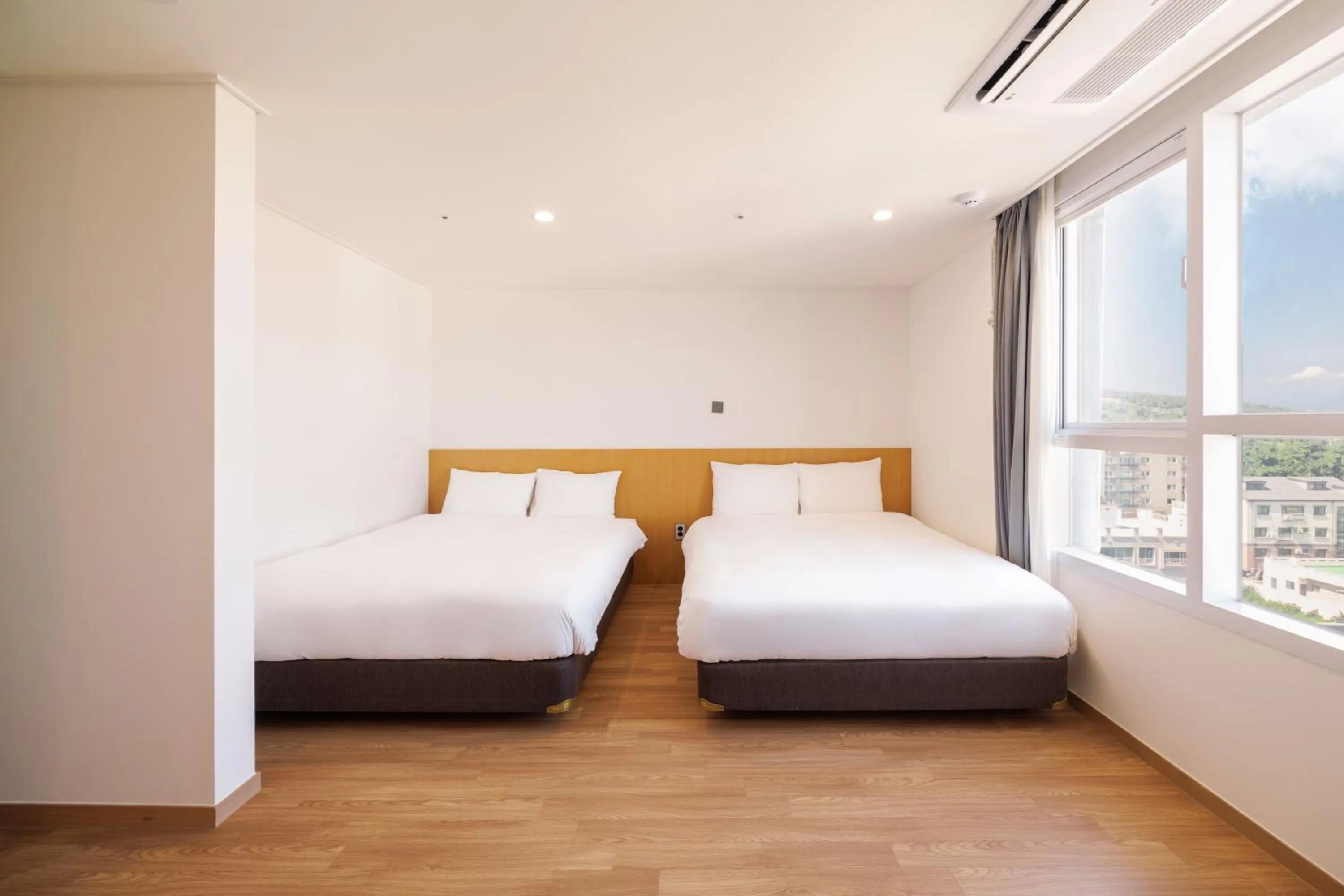 Bed in Kenny Stay Jeju Mosulpo