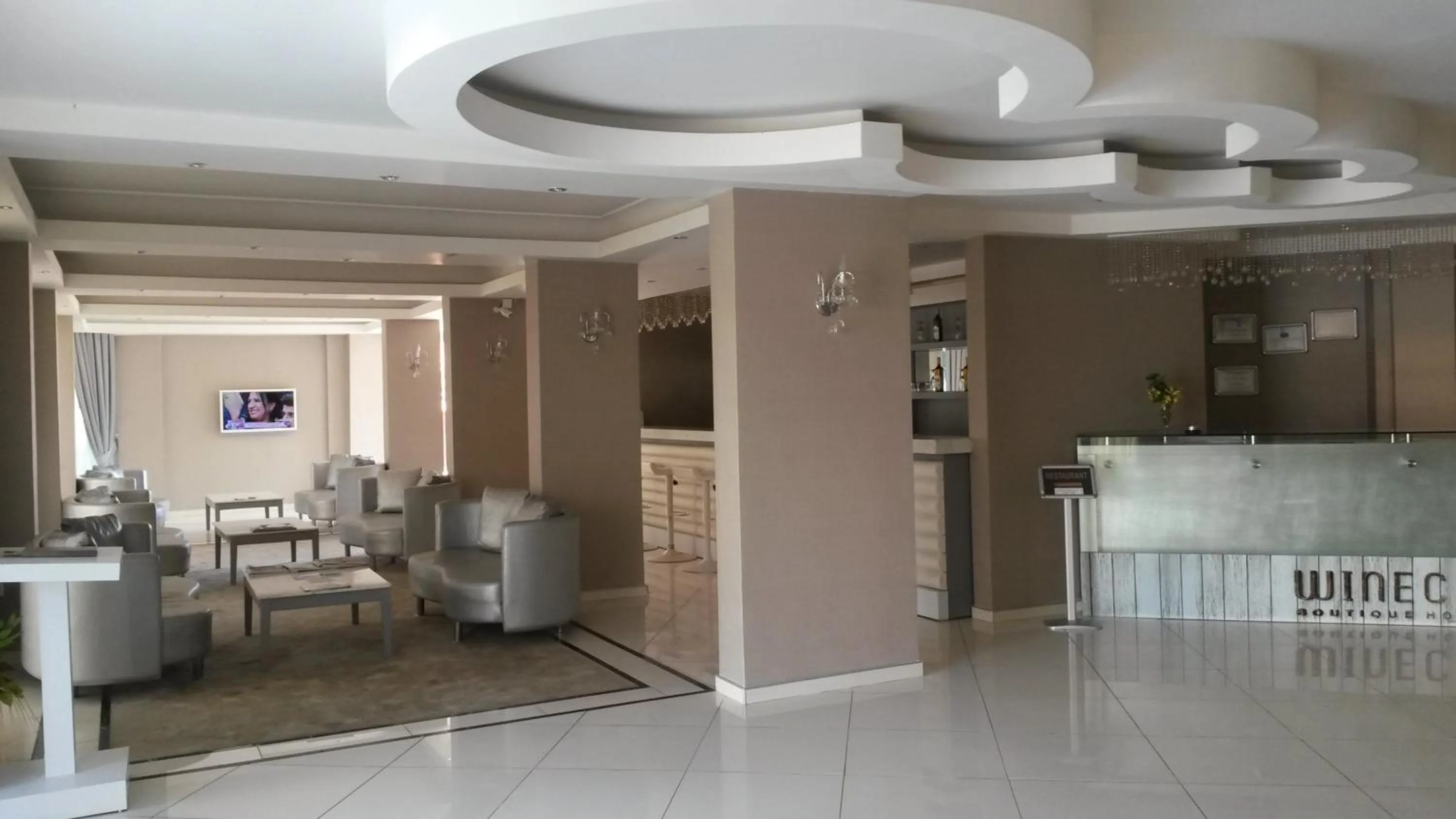 Communal lounge/ TV room, Lobby/Reception in Winecity Hotel