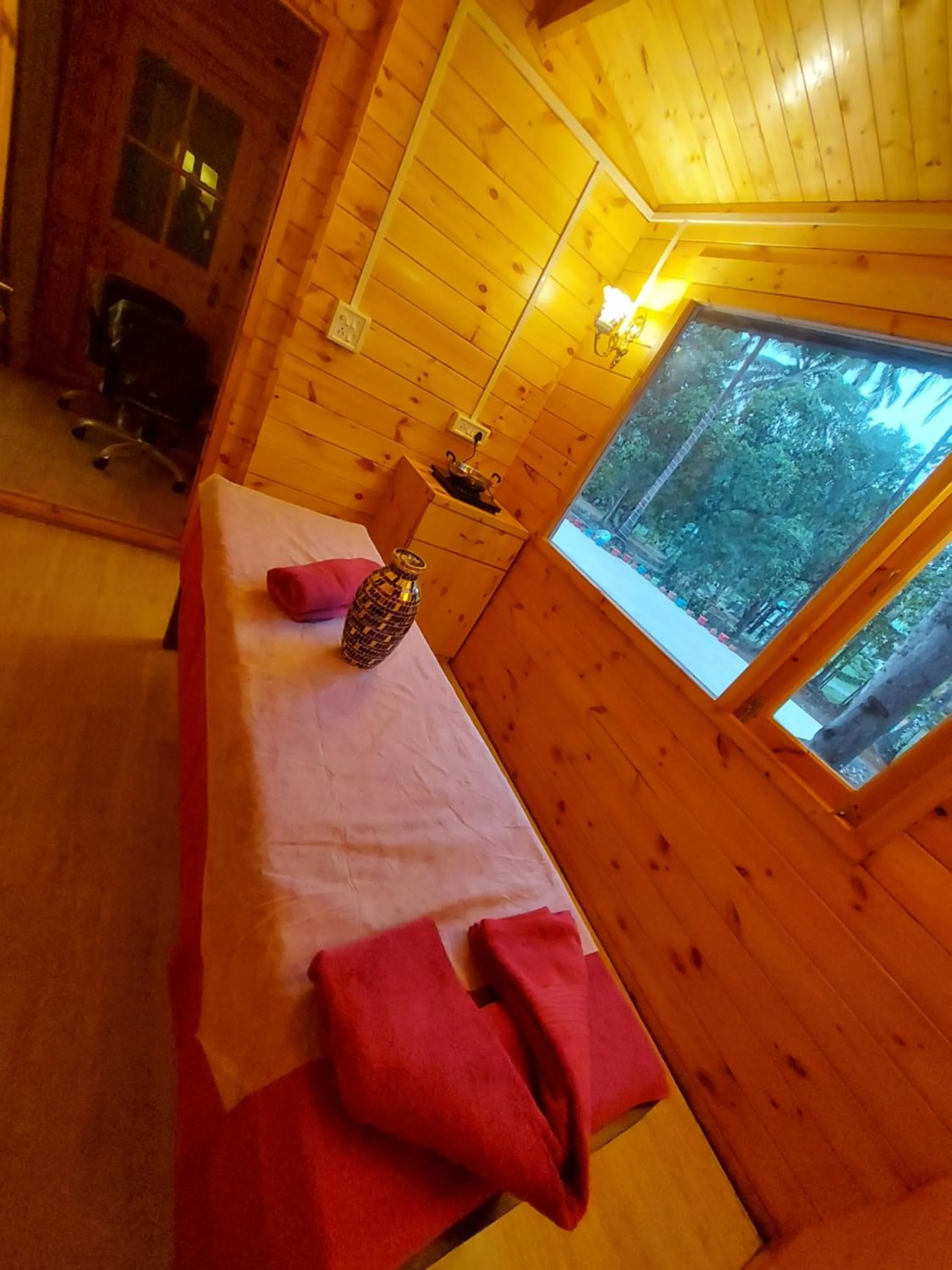 Bed in Adhvasaha Beach Spa Resort