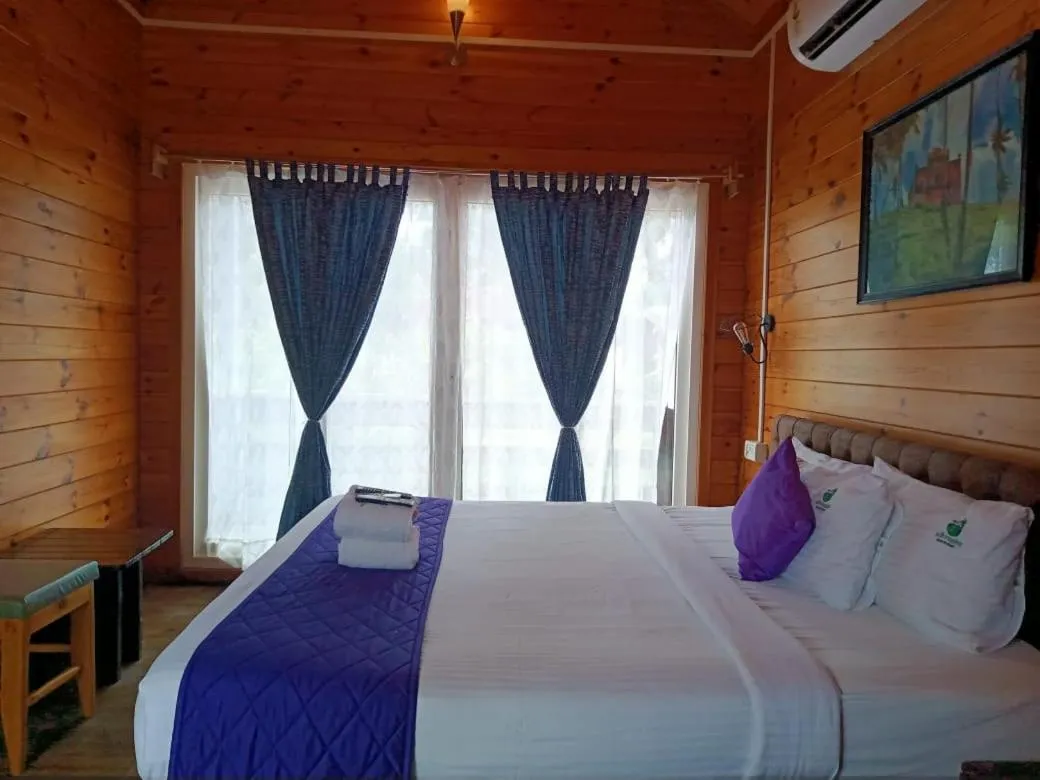 Bed in Adhvasaha Beach Spa Resort