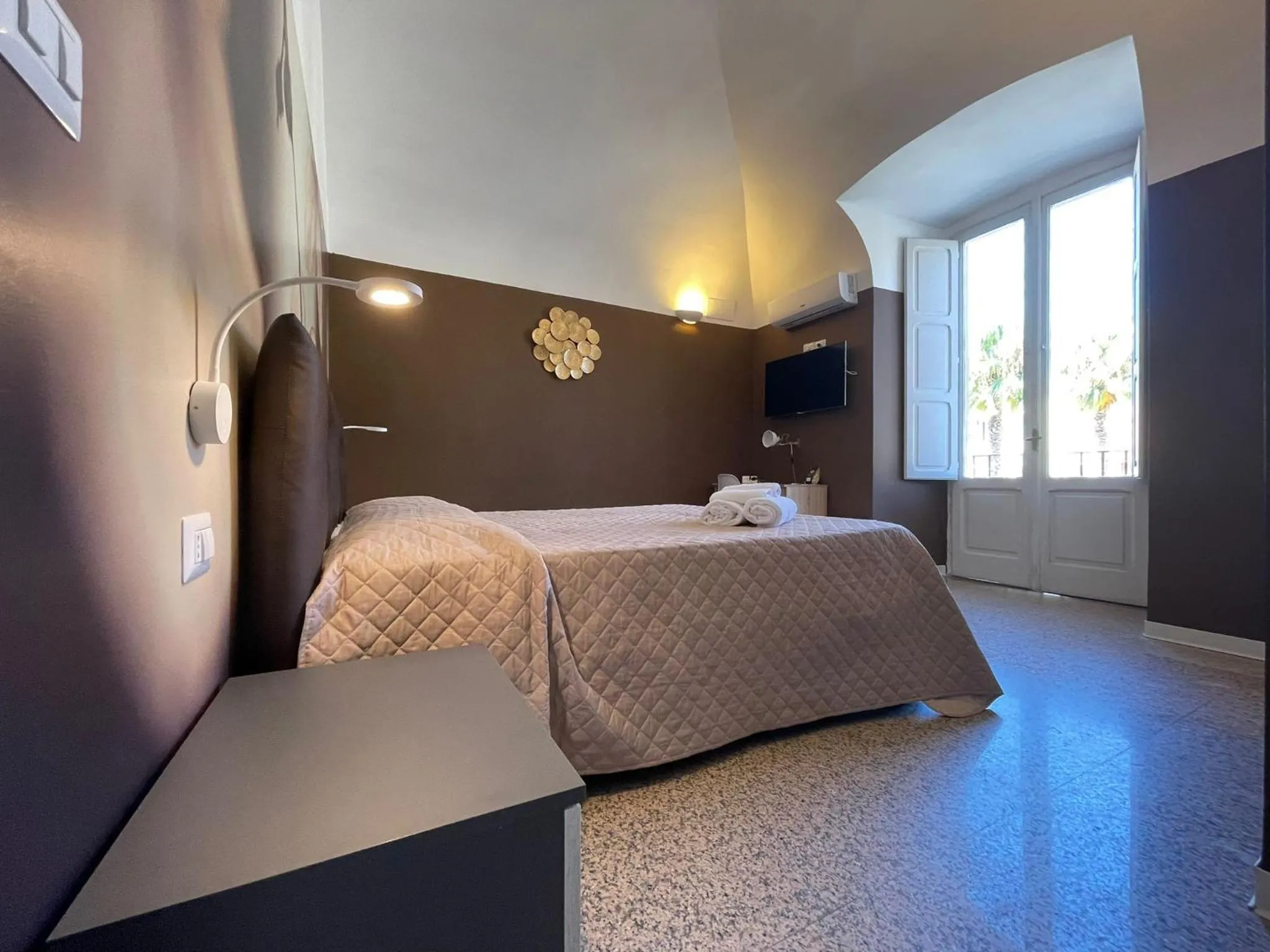 Bed in CconfortHotels Central Rooms