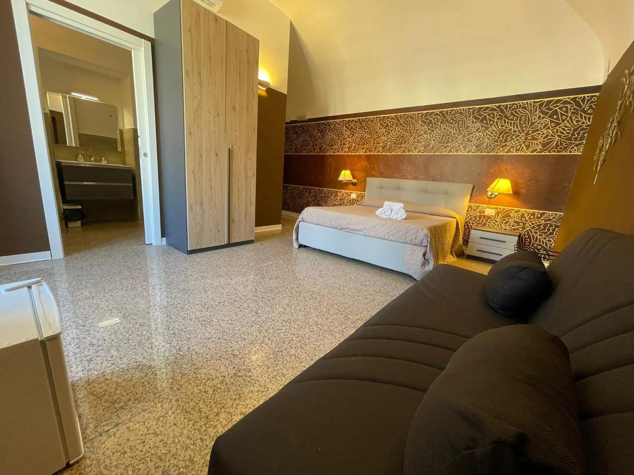 Bed in CconfortHotels Central Rooms