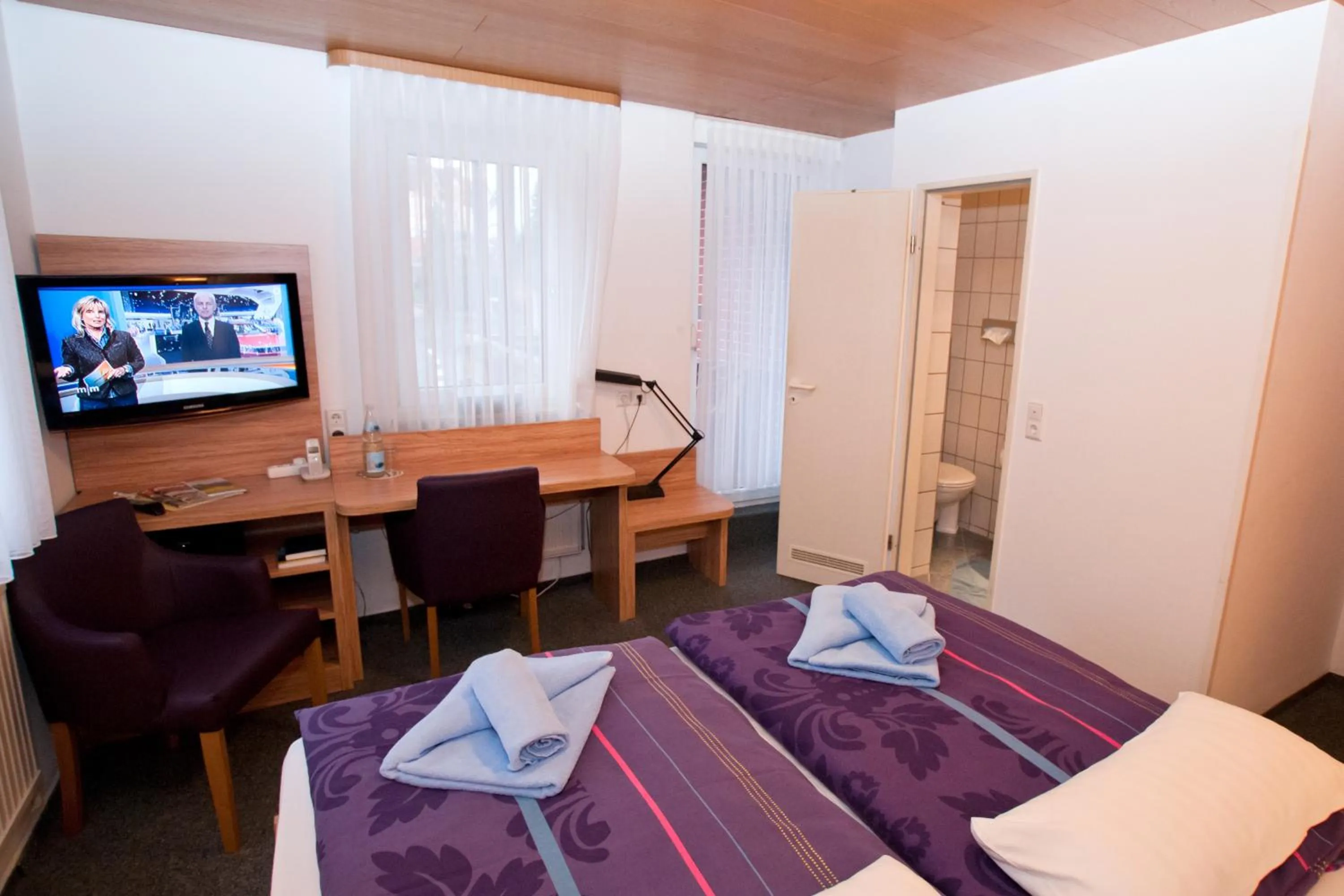 Photo of the whole room, Bed in Landgasthaus Bonn