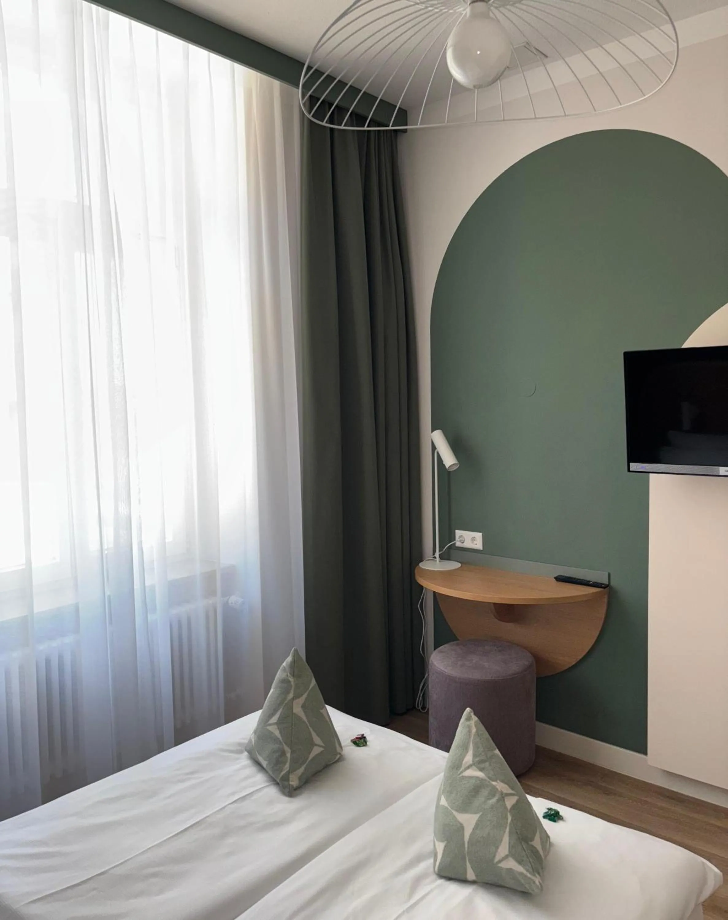 Bed in Gästehaus Centro in Konstanz