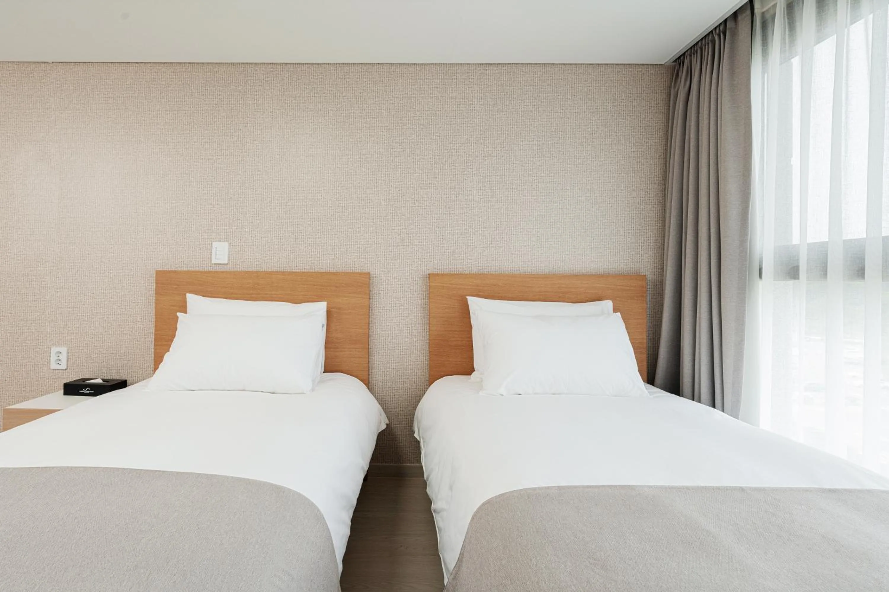 Bed in CENTUMMARK Hotel YangYang