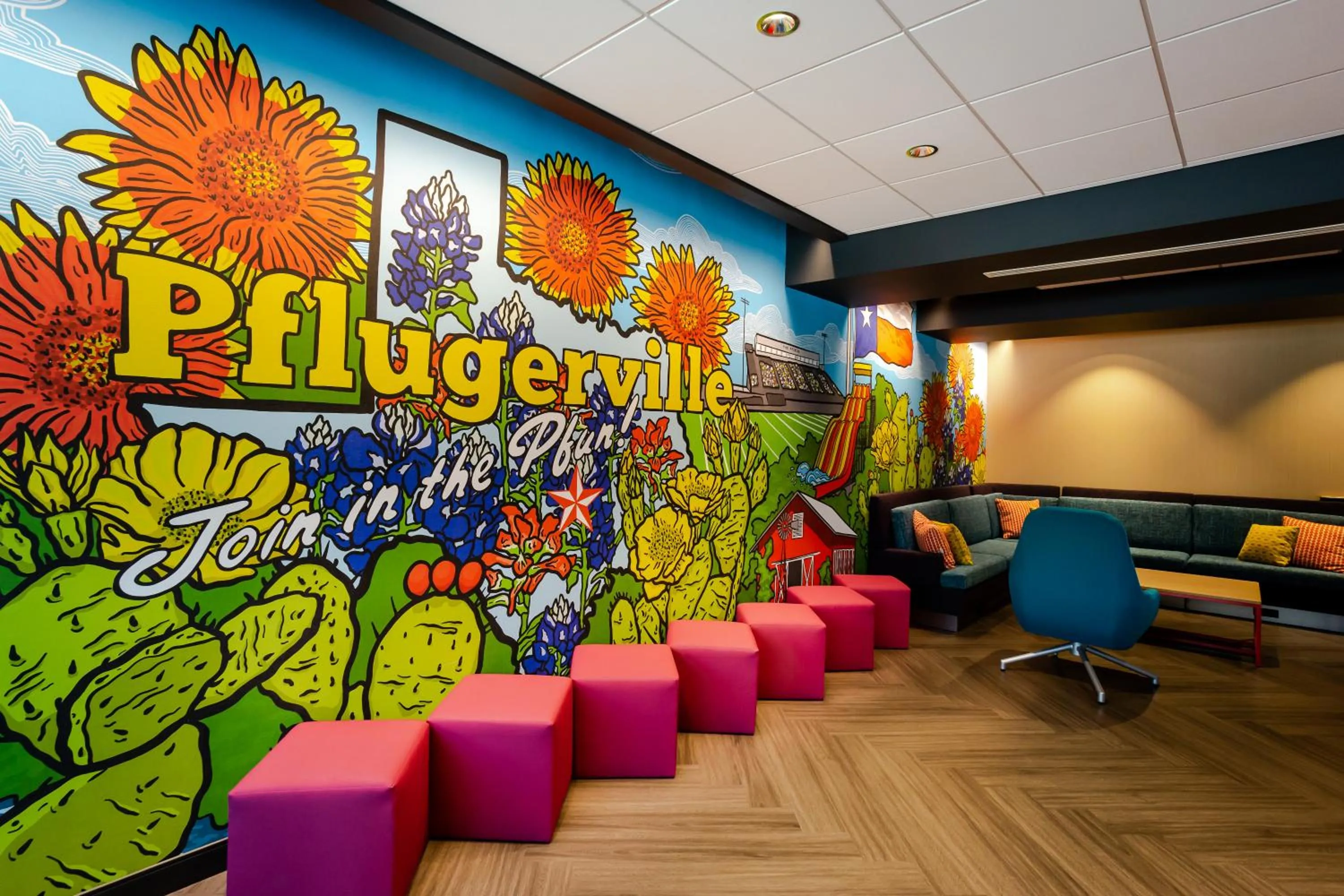 Communal lounge/ TV room in Tru by Hilton Pflugerville, TX