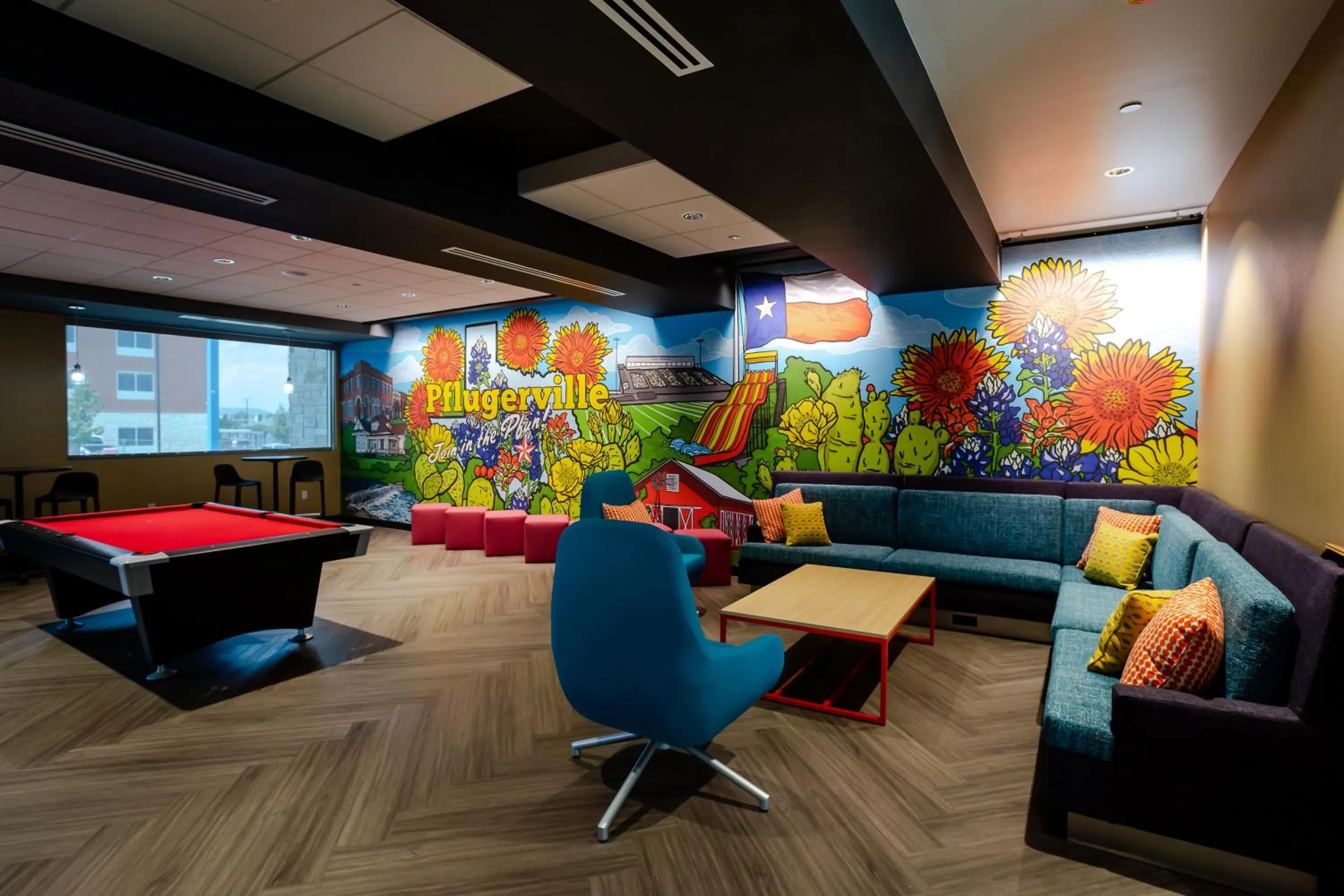 Communal lounge/ TV room in Tru by Hilton Pflugerville, TX