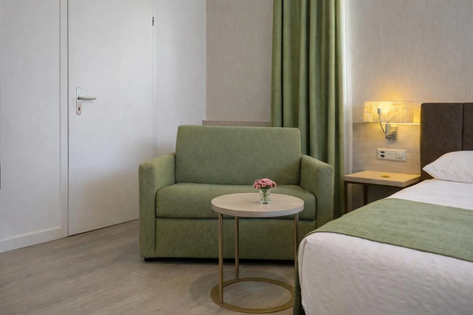 Photo of the whole room, Bed in Hotel Nessi Locarno