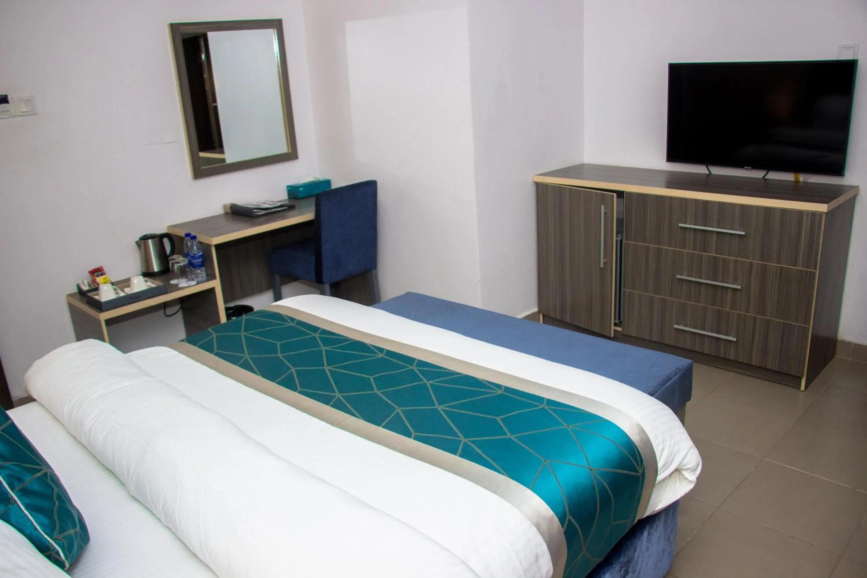 Bed in Riviera Suites