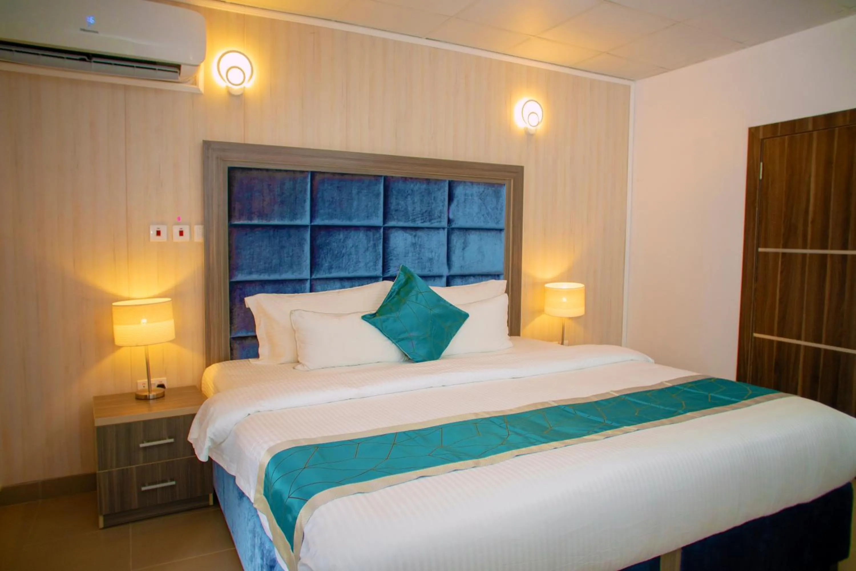 Bed in Riviera Suites