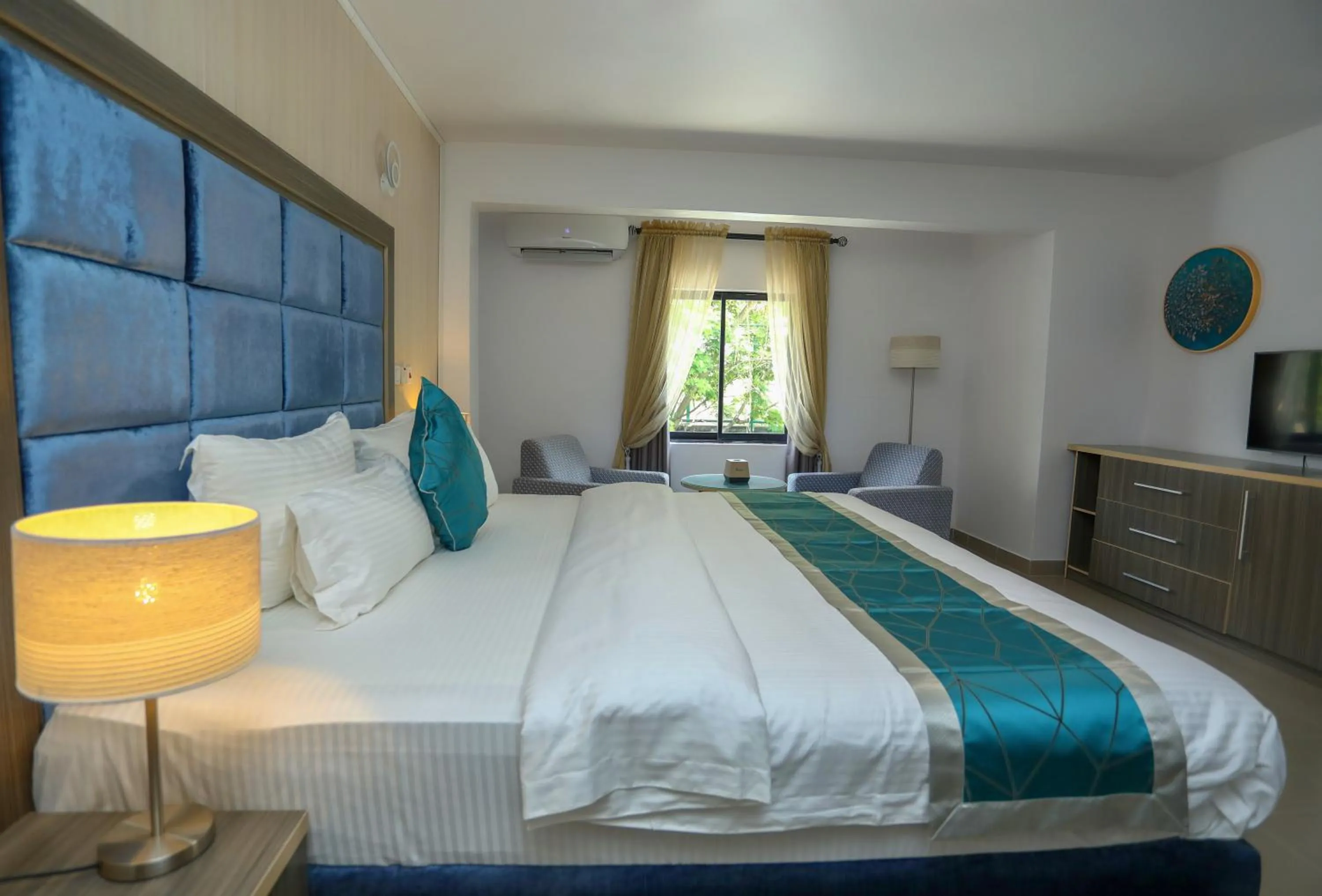 Bed in Riviera Suites