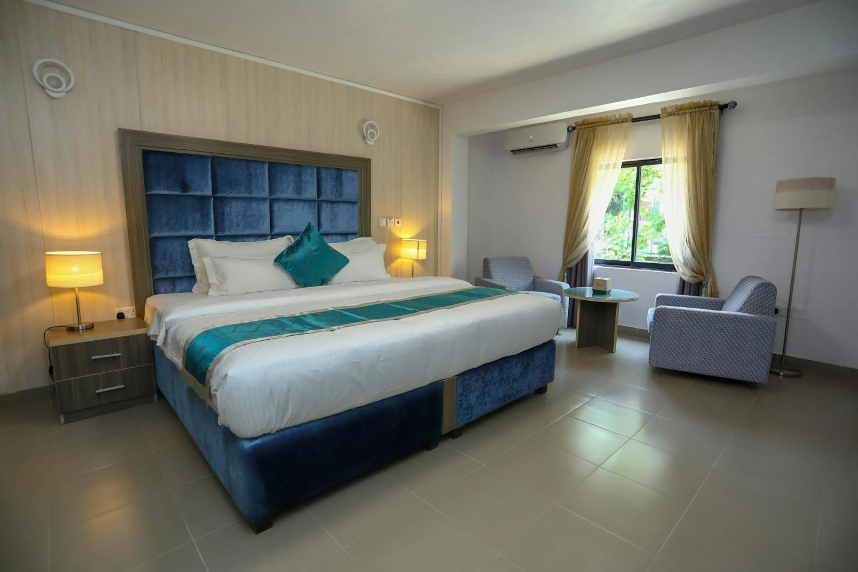 Bed in Riviera Suites