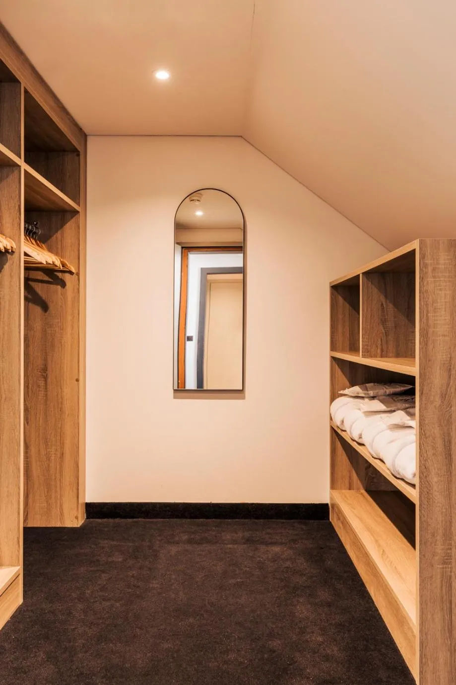 wardrobe, Bed in Hotel Altein Arosa, a Faern Collection Resort