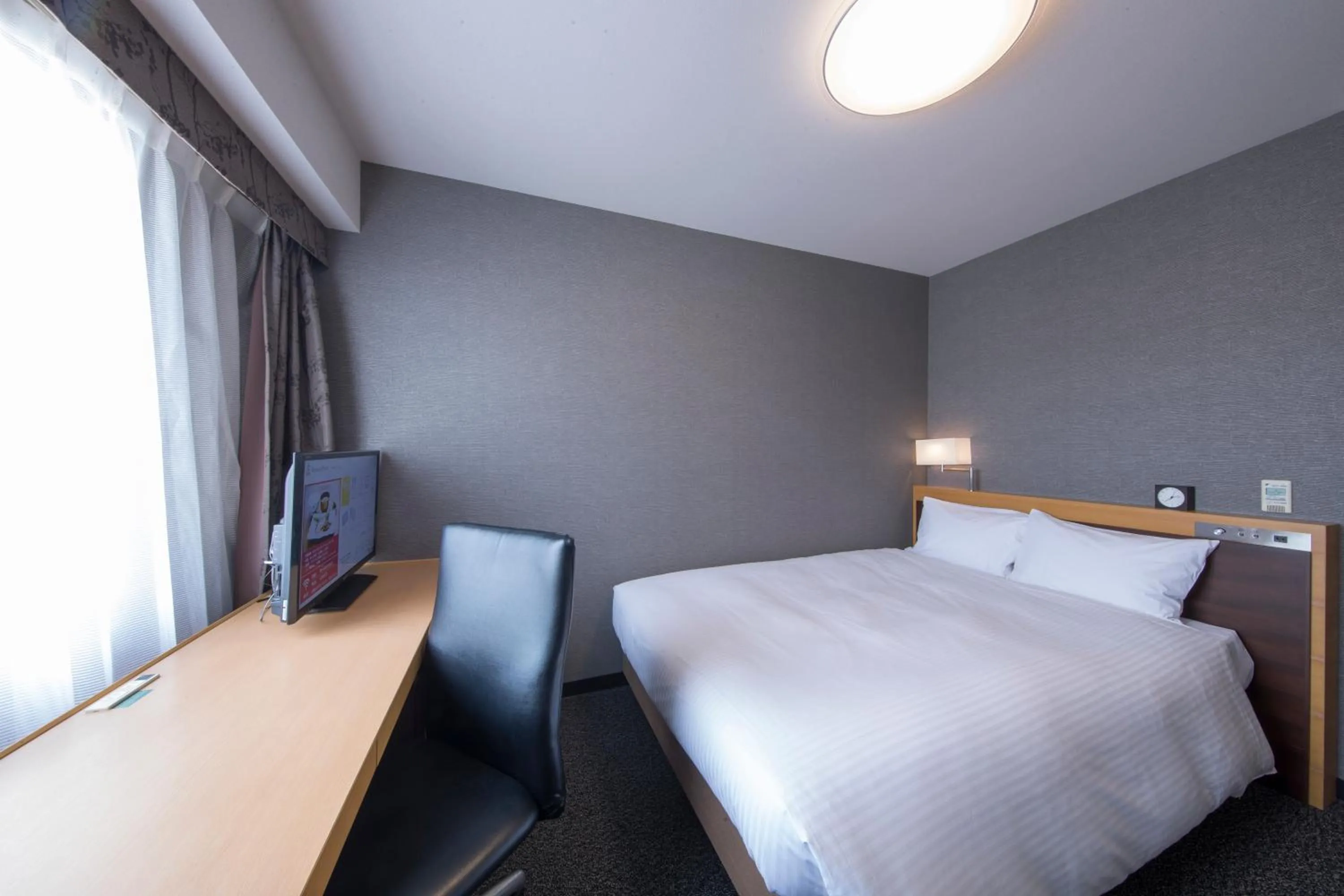 Bed in Richmond Hotel Kumamoto Shinshigai