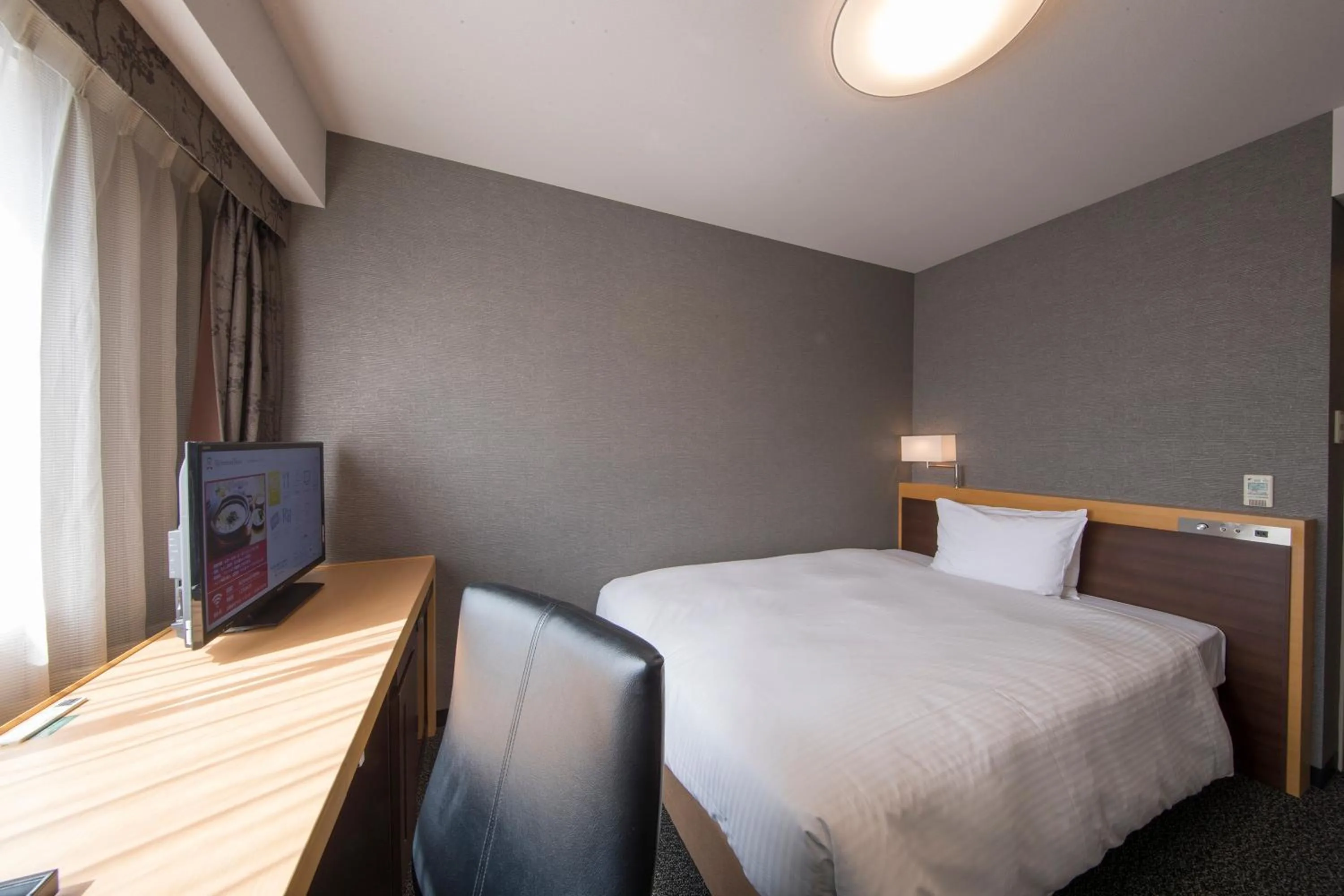 Bed in Richmond Hotel Kumamoto Shinshigai