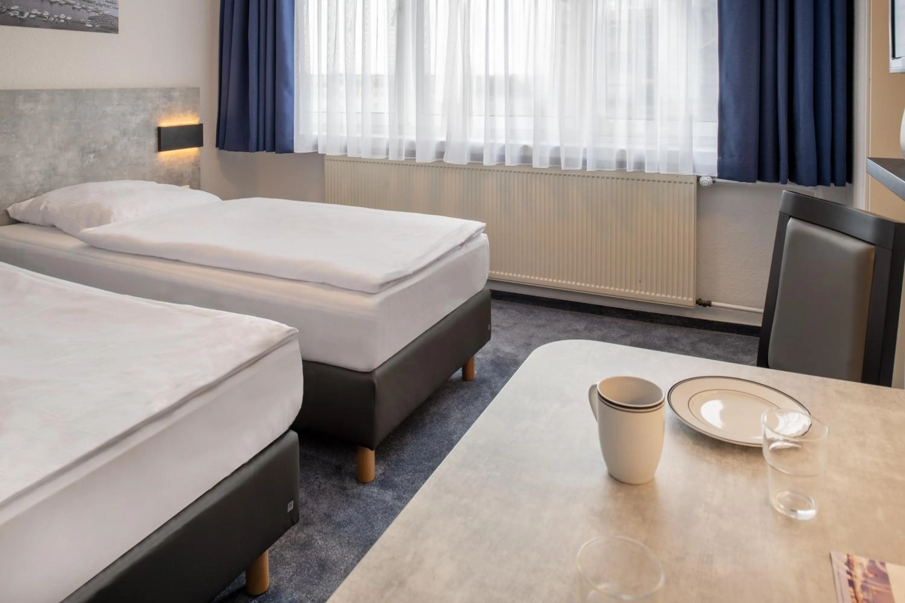 Photo of the whole room, Bed in Hotel & Gästehaus Rostock Lütten Klein