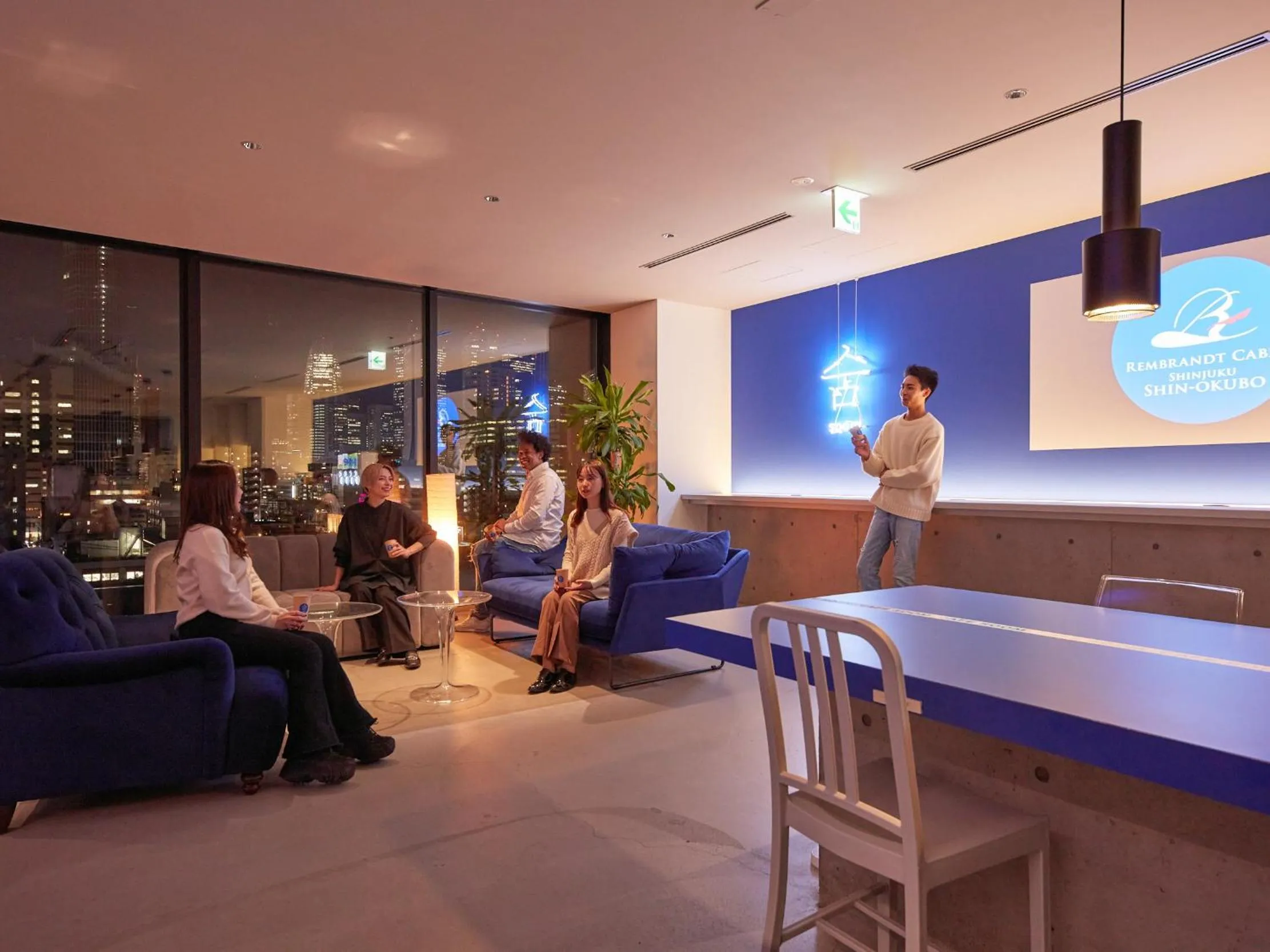 Communal lounge/ TV room in Rembrandt Cabin Shinjuku Shin-Okubo