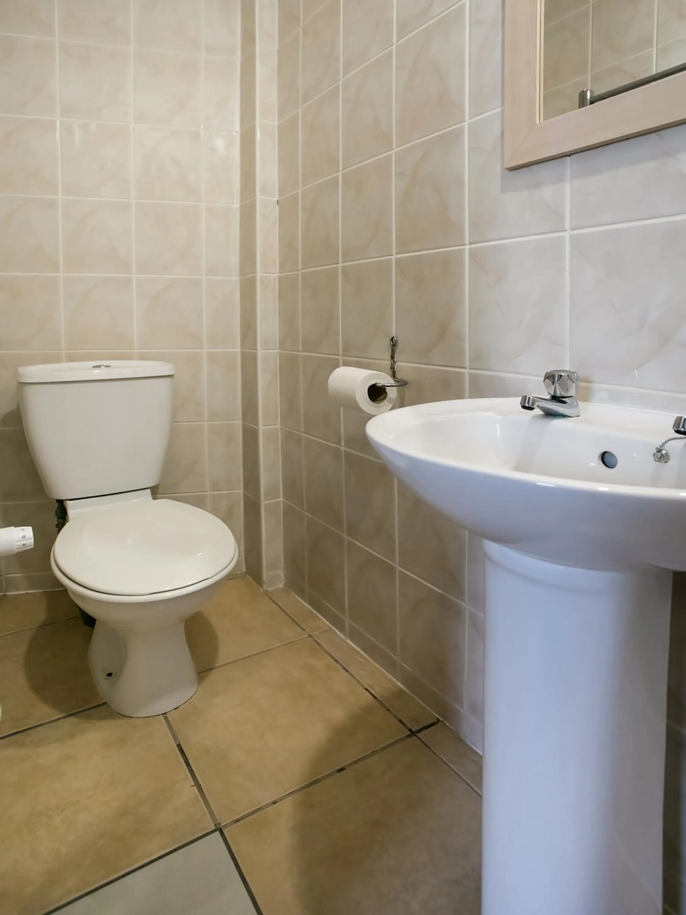 Bathroom in OYO Gin House Hotel