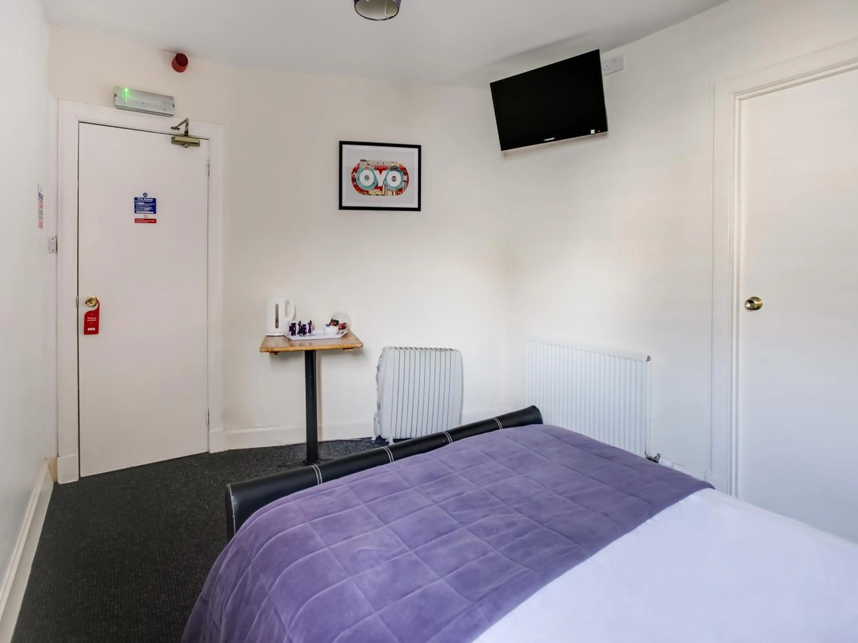 Bed in OYO Gin House Hotel