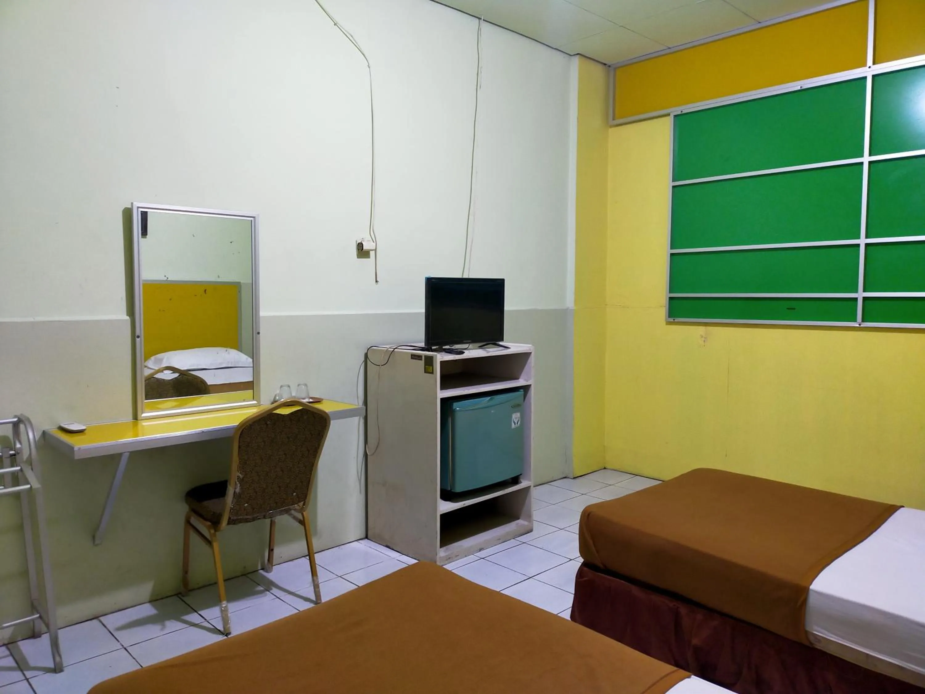 Bedroom, Bed in Hotel Nirwana Ternate RedPartner