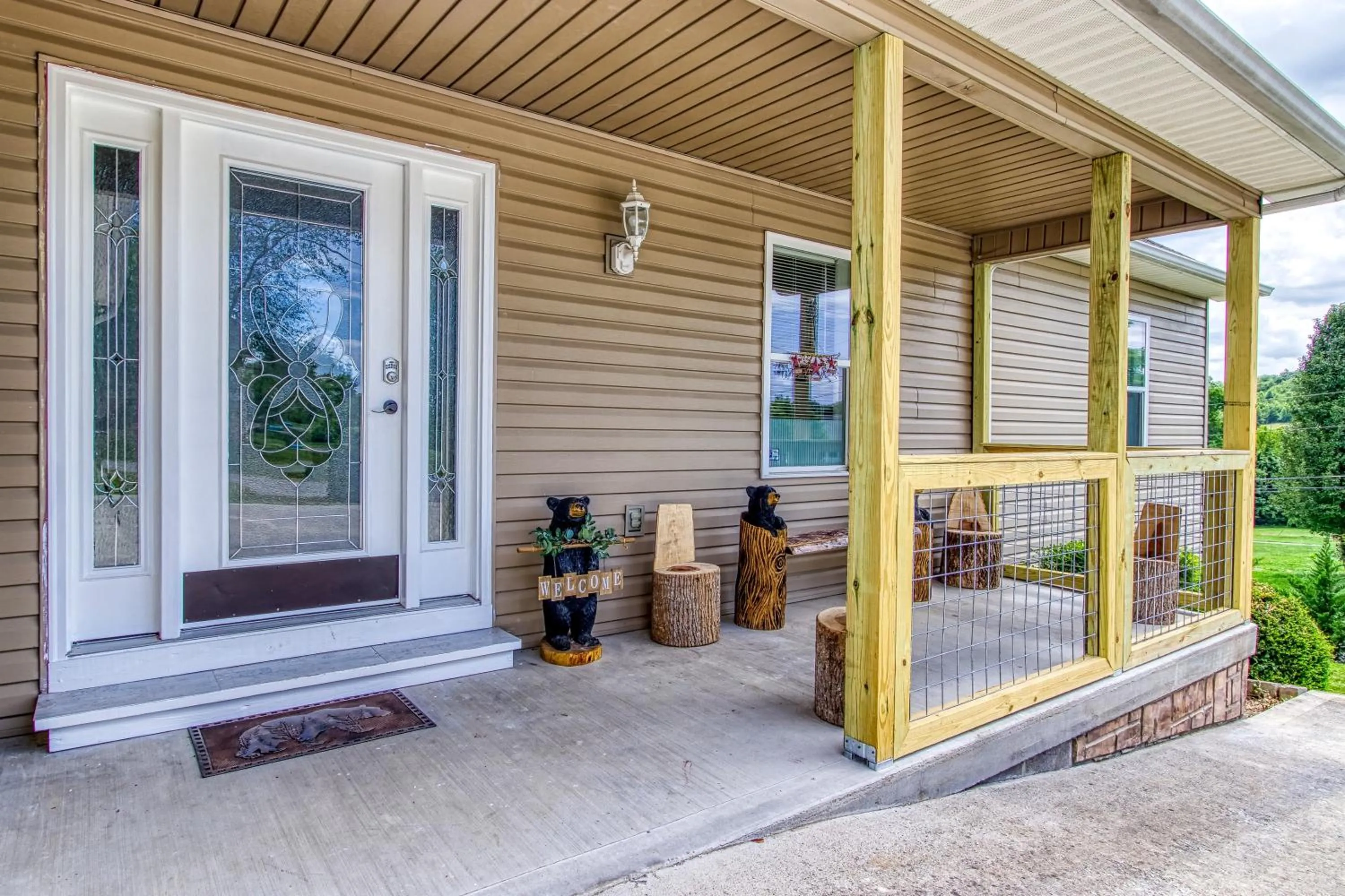 Facade/entrance in Rustic River Lodge by HoneyBearCabins 7BR 6BA sleeps 21