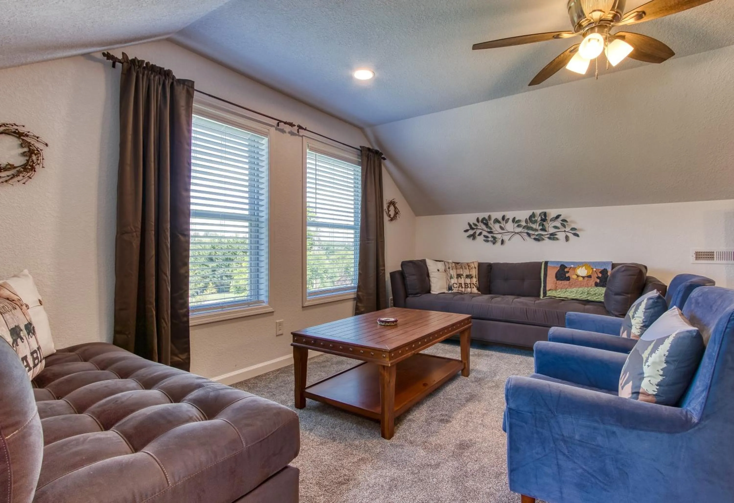 Living room in Rustic River Lodge by HoneyBearCabins 7BR 6BA sleeps 21