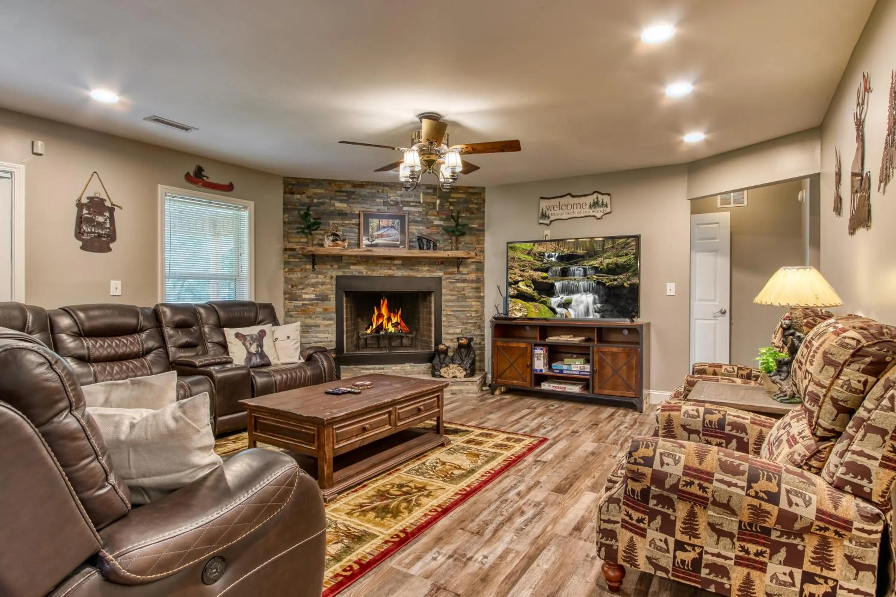 TV and multimedia in Rustic River Lodge by HoneyBearCabins 7BR 6BA sleeps 21