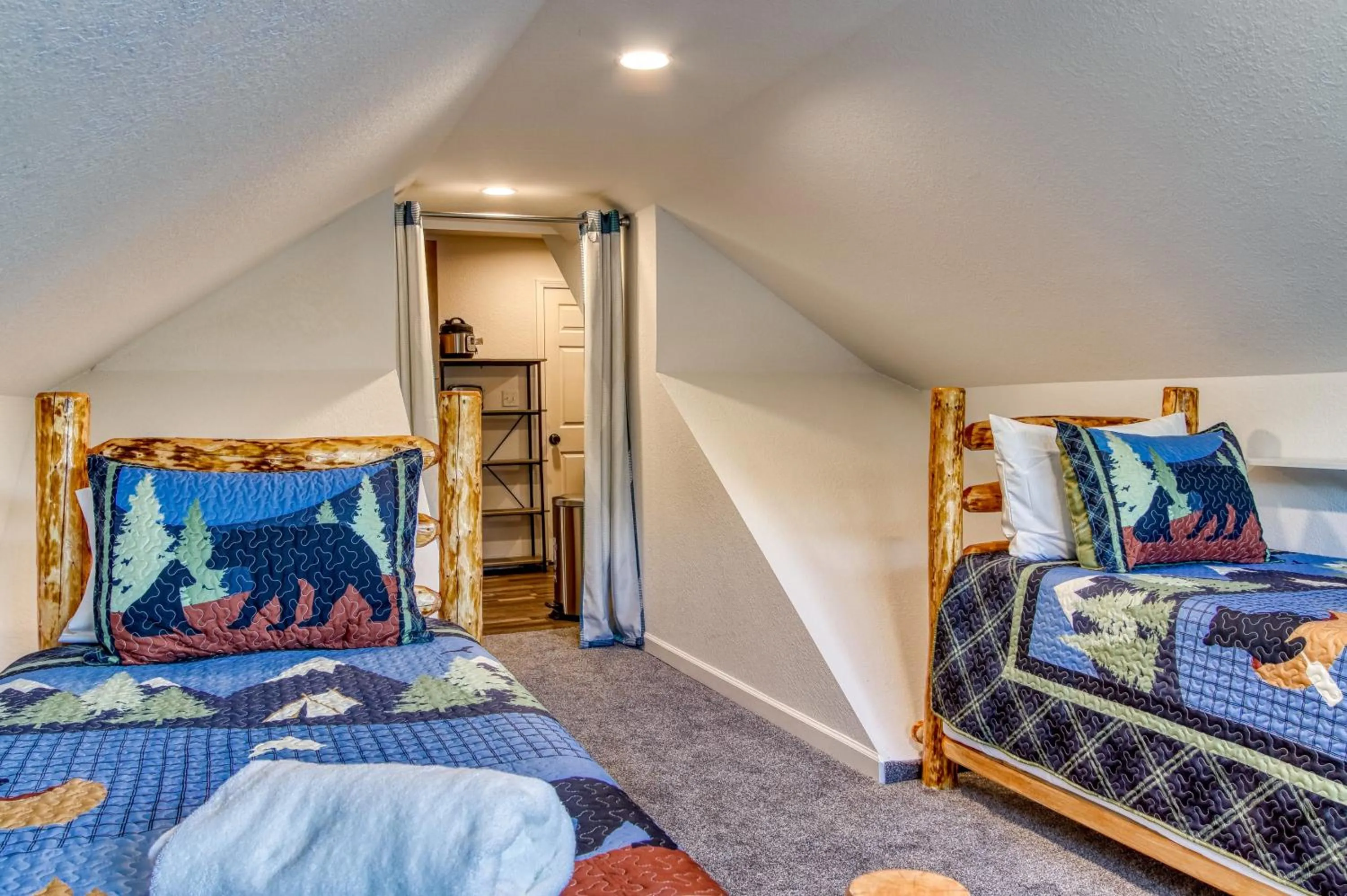 Bed in Rustic River Lodge by HoneyBearCabins 7BR 6BA sleeps 21