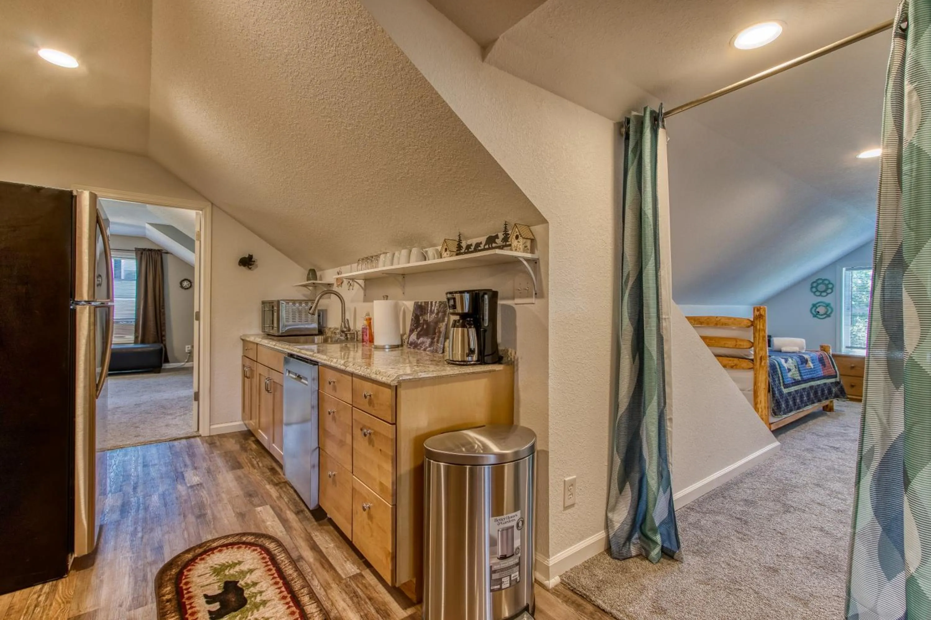 Kitchen or kitchenette in Rustic River Lodge by HoneyBearCabins 7BR 6BA sleeps 21