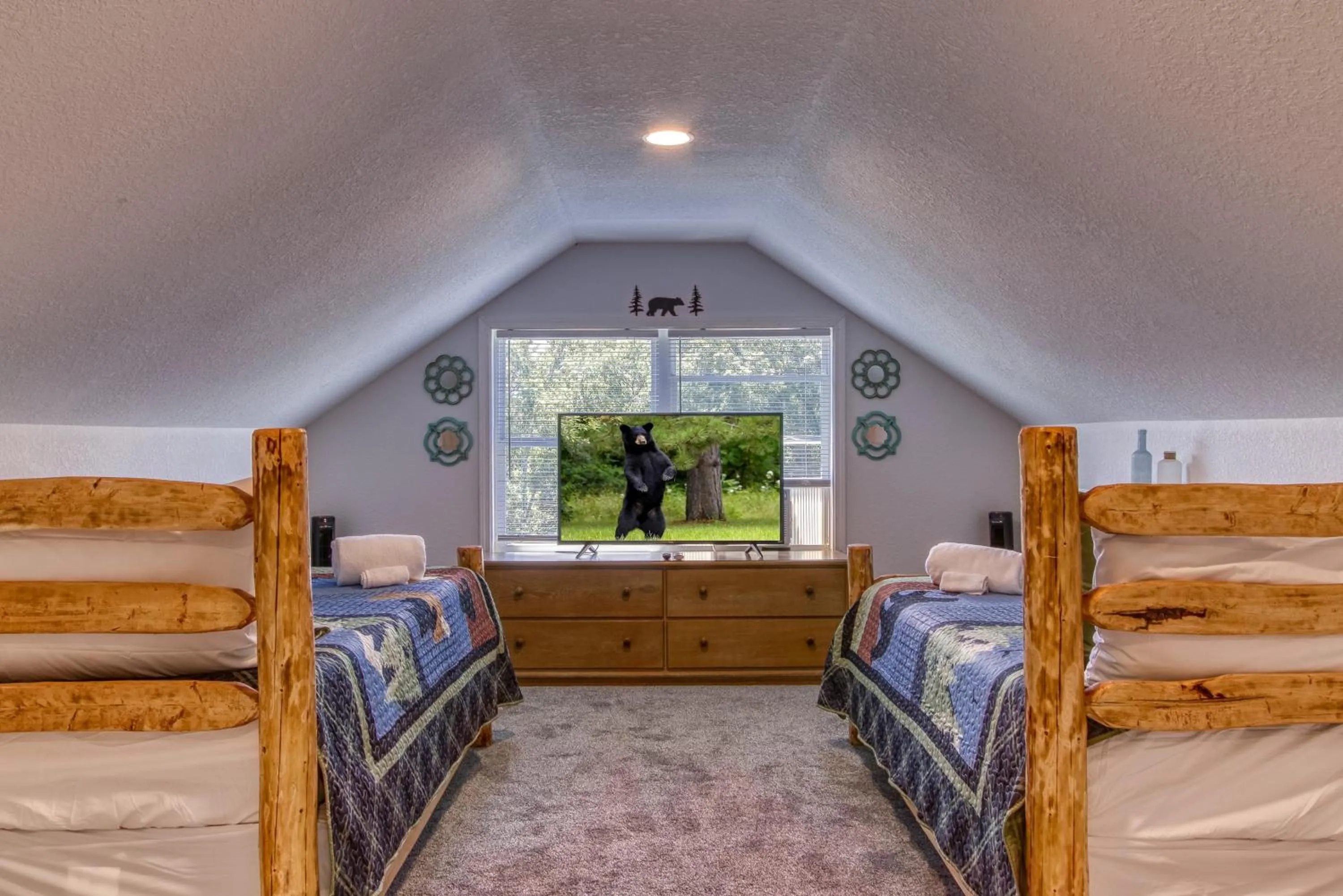 Bed in Rustic River Lodge by HoneyBearCabins 7BR 6BA sleeps 21