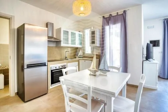 Kitchen or kitchenette in Villa Arya - Piscina privata By Cala Salento