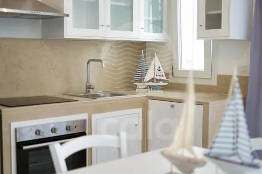 Kitchen or kitchenette in Villa Arya - Piscina privata By Cala Salento