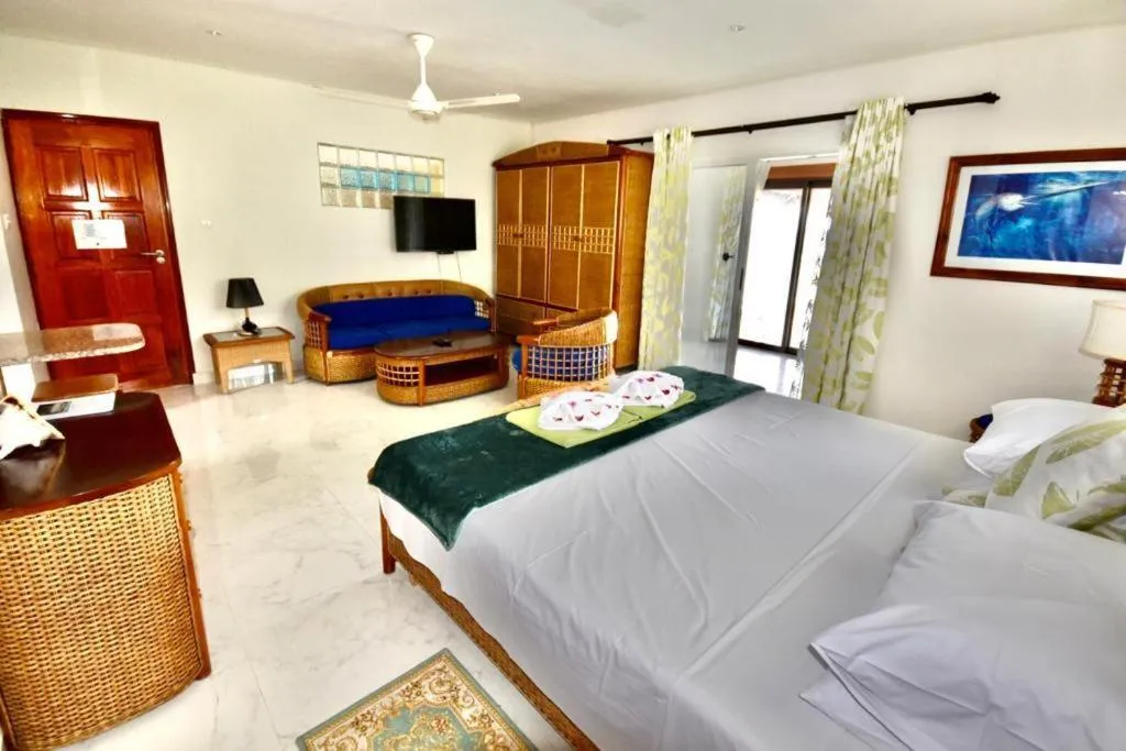 Bed in SEA SPLASH SELF CATERING And La Petite Maison