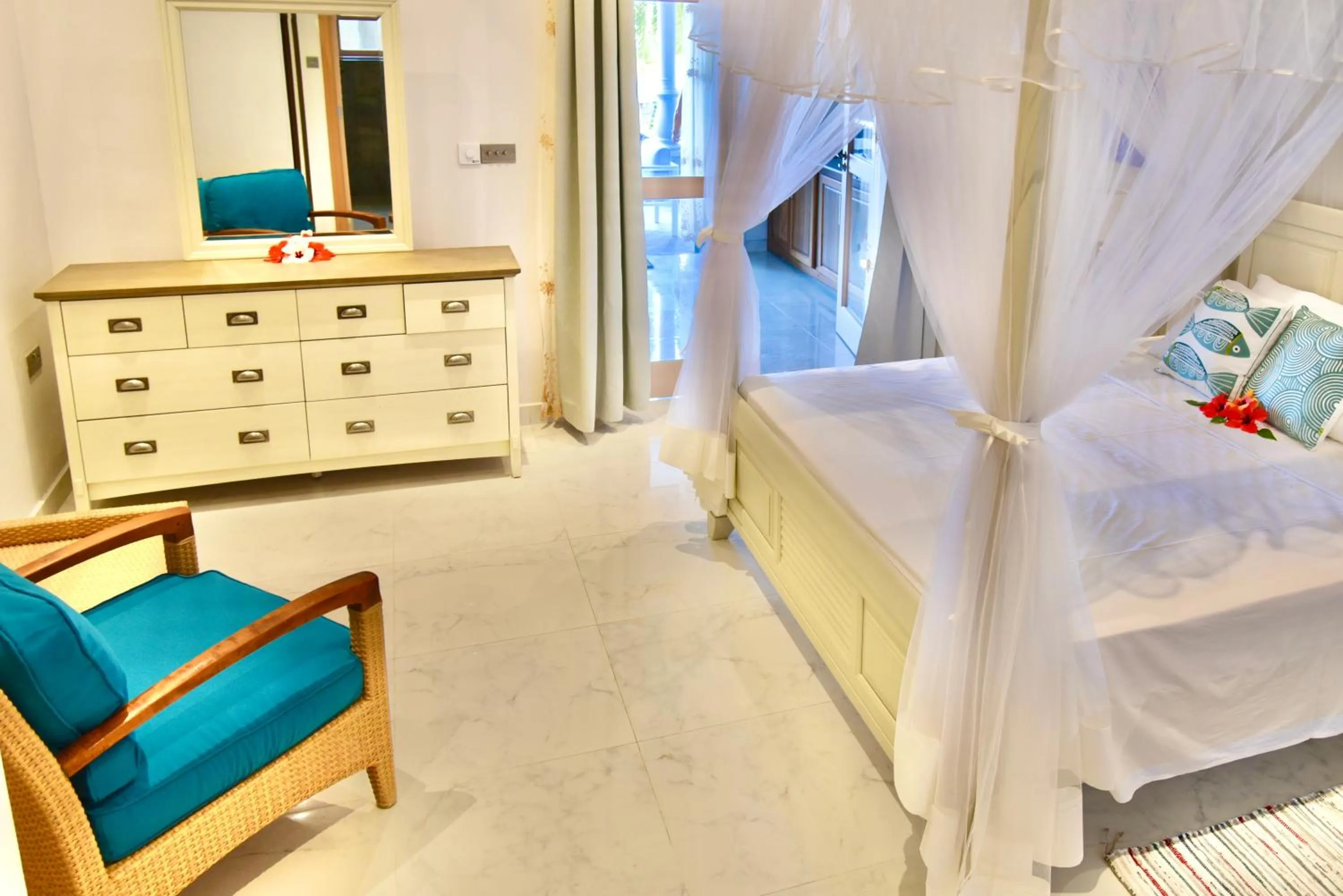 Bed in SEA SPLASH SELF CATERING And La Petite Maison