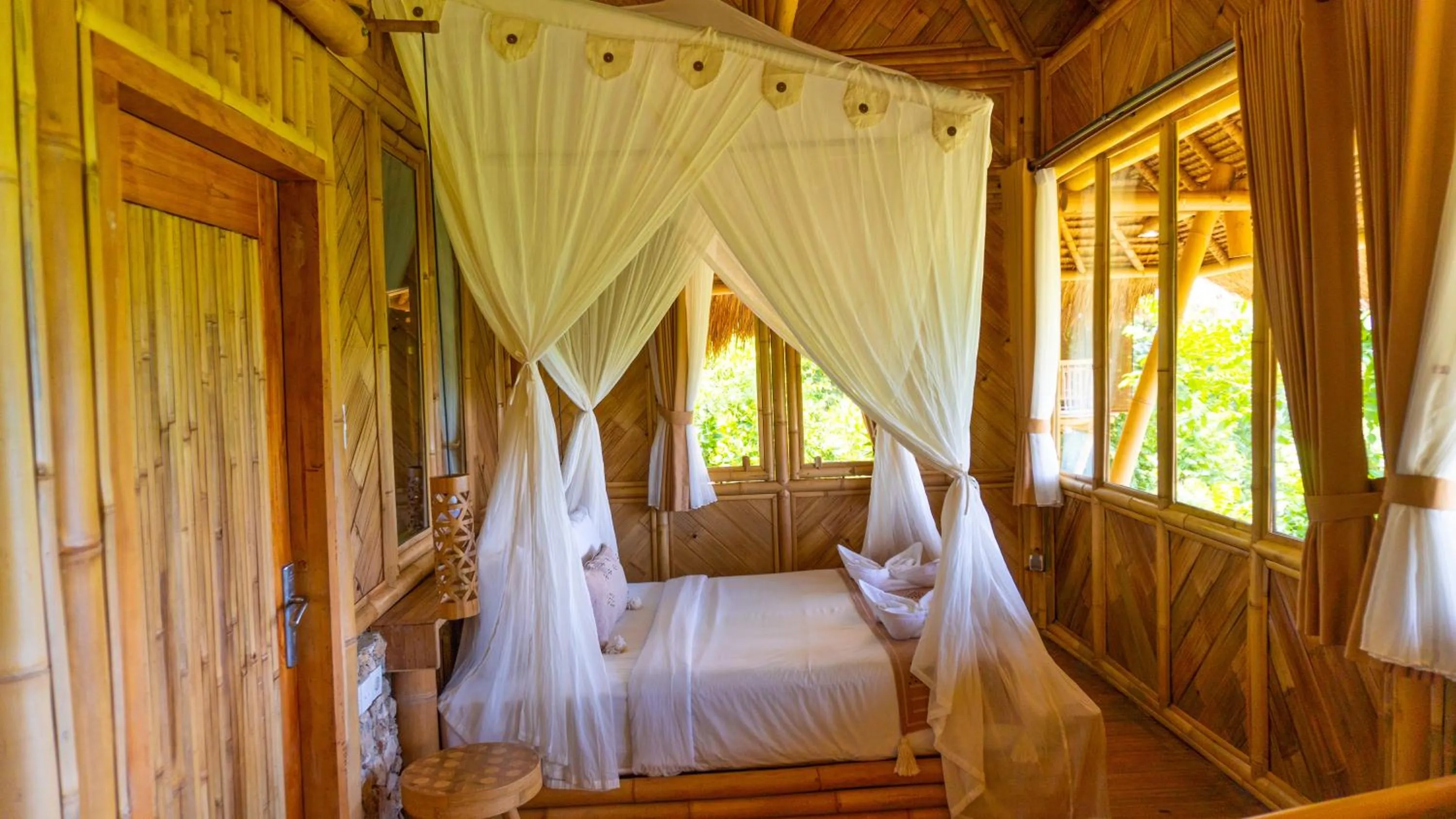 Bed in Elang Hillside Bamboo Villas