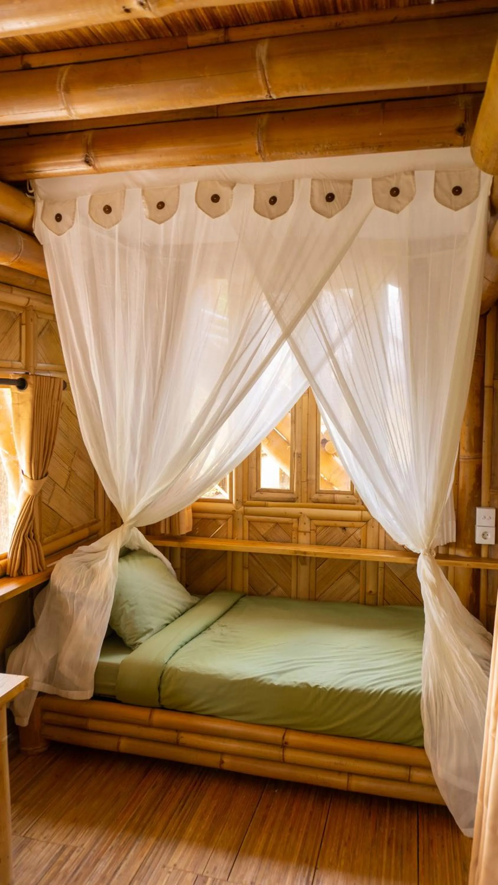 Bed in Elang Hillside Bamboo Villas