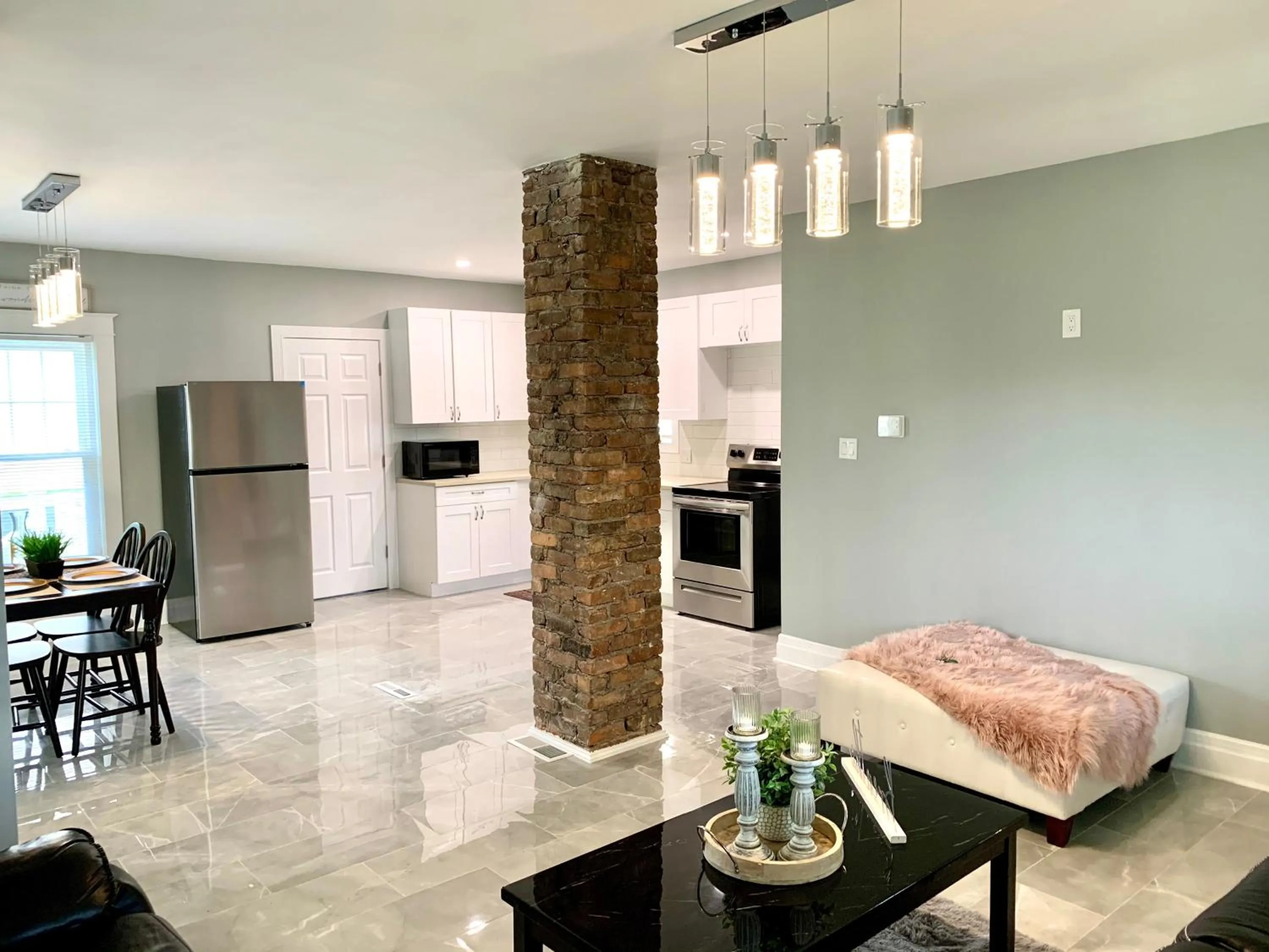 Living room in The Oakwood Cottage- With Private Yard & Parking, Minutes From Falls & Casino by Niagara Hospitality