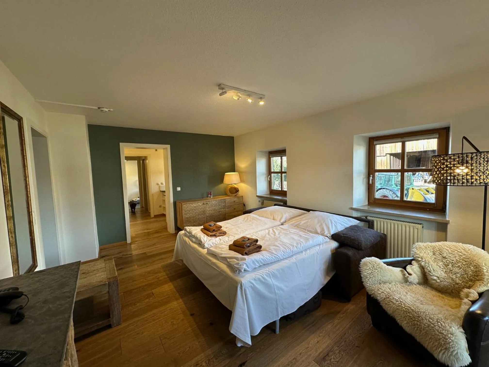 Living room, Bed in Landhaus Kössel