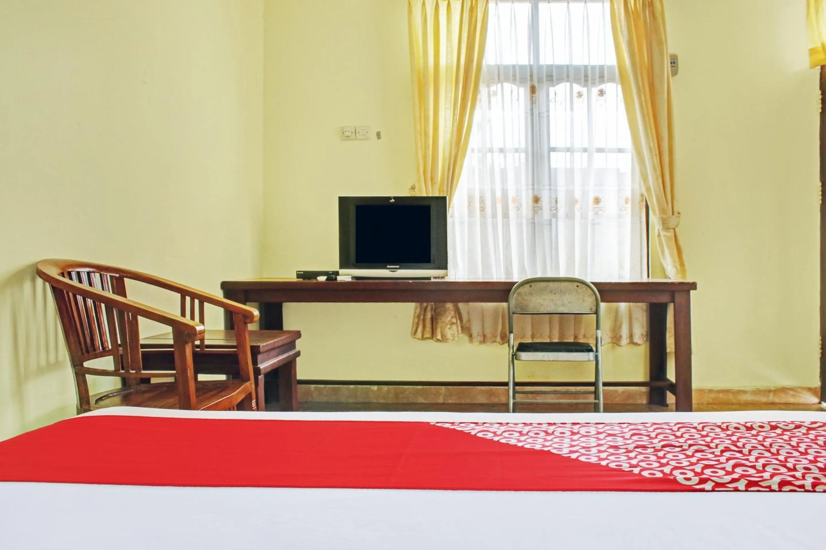 Bedroom in Hotel O Aman